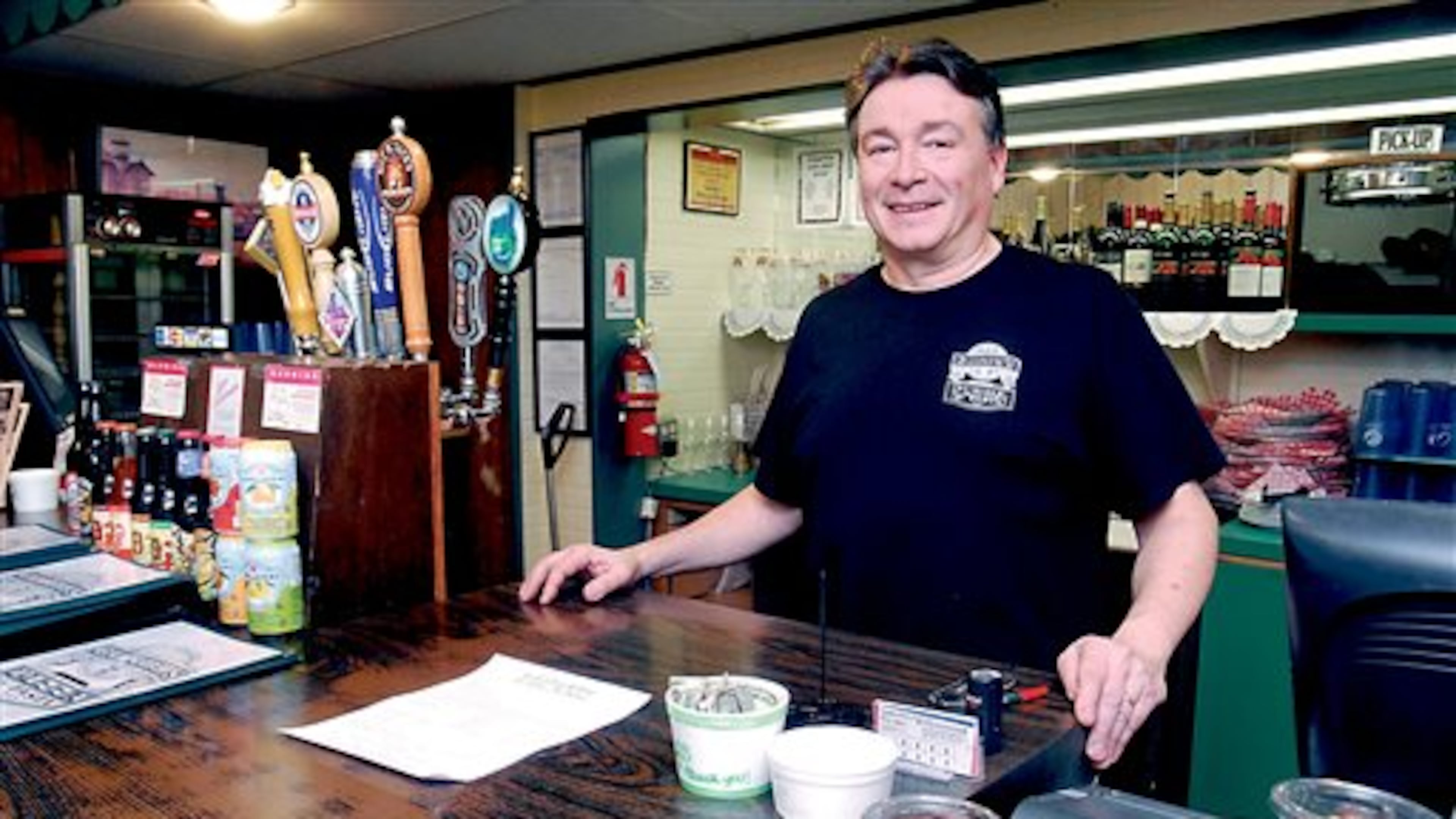 Randy Sexton, owner of Gordy's Pizza & Pasta in Port Angeles, Wash., poses for a photo at his restaurant on Friday, Feb. 28, 2014. The eatery was inundated with calls last Wednesday night from people trying to vote for their favorite contestants on "American Idol." Sexton says it's not clear why the calls were misdirected, but he hopes the problem gets fixed before next week's episode. (AP Photo/Peninsula Daily News, Keith Thorpe)