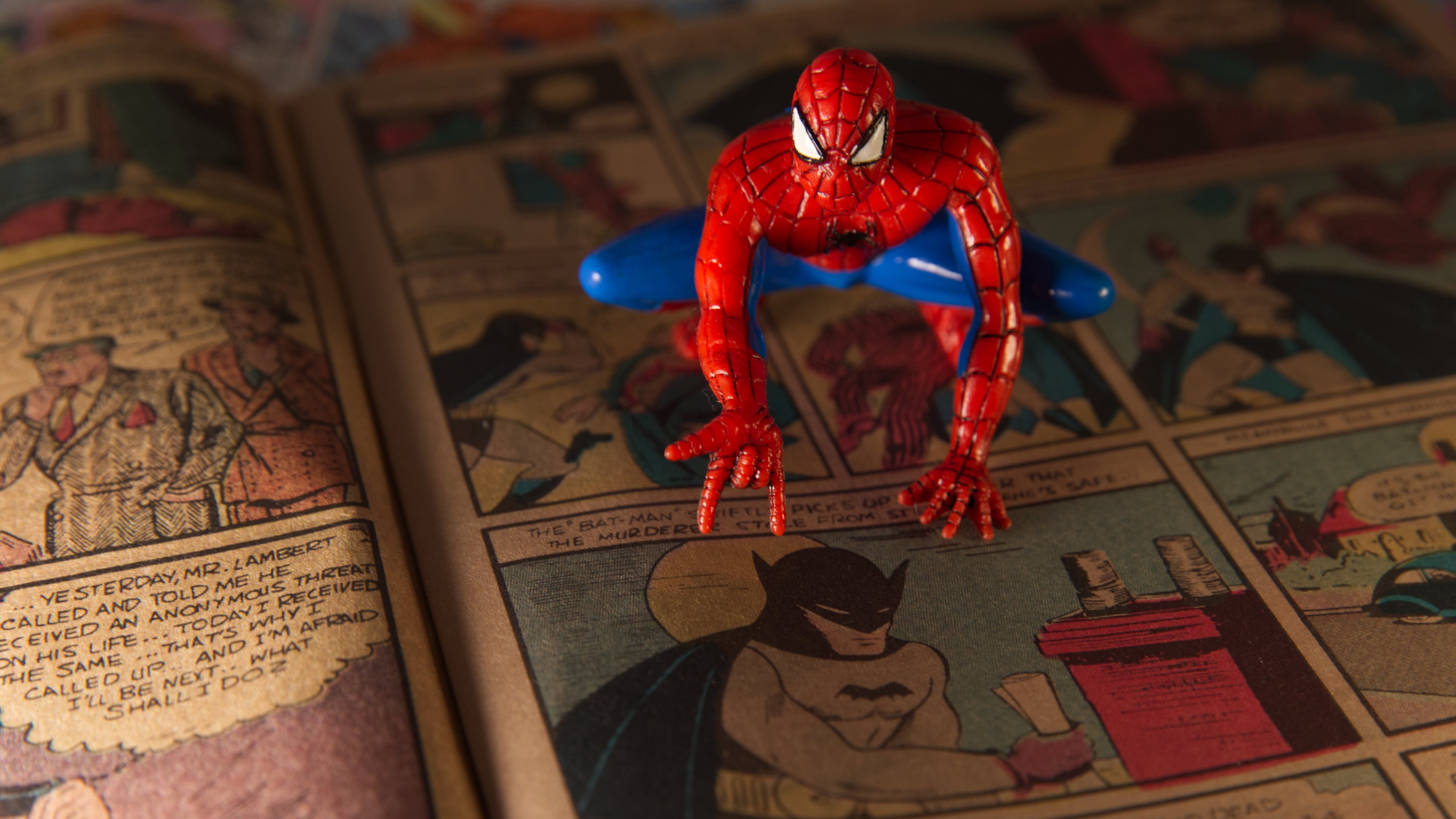 A Spiderman figurine sits atop a facsimile copy of the May 1939 Detective Comics anthology series in Phoenix, Thursday May 14, 2026. This issue made history for including the debut of the Batman superhero in a story called "The Case of the Chemical Syndicate". (AP Photo/Dario Lopez-Mills)
