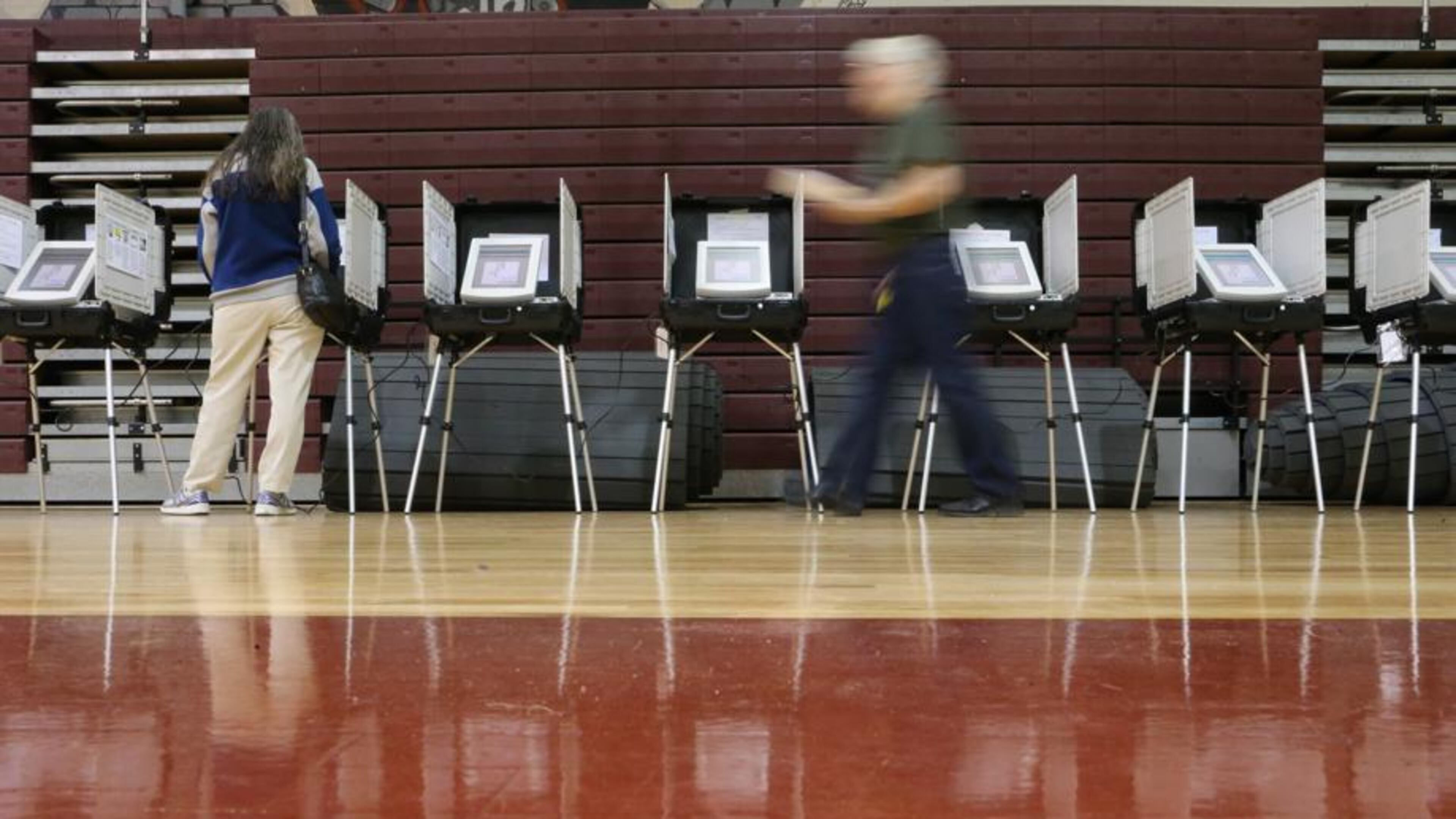 Woodstock residents will have to visit two polling places Nov. 6 to vote in both the statewide general election, and the municipal special election to roll back to 11 a.m. the Sunday serving hour for alcohol, the city advises. AJC FILE