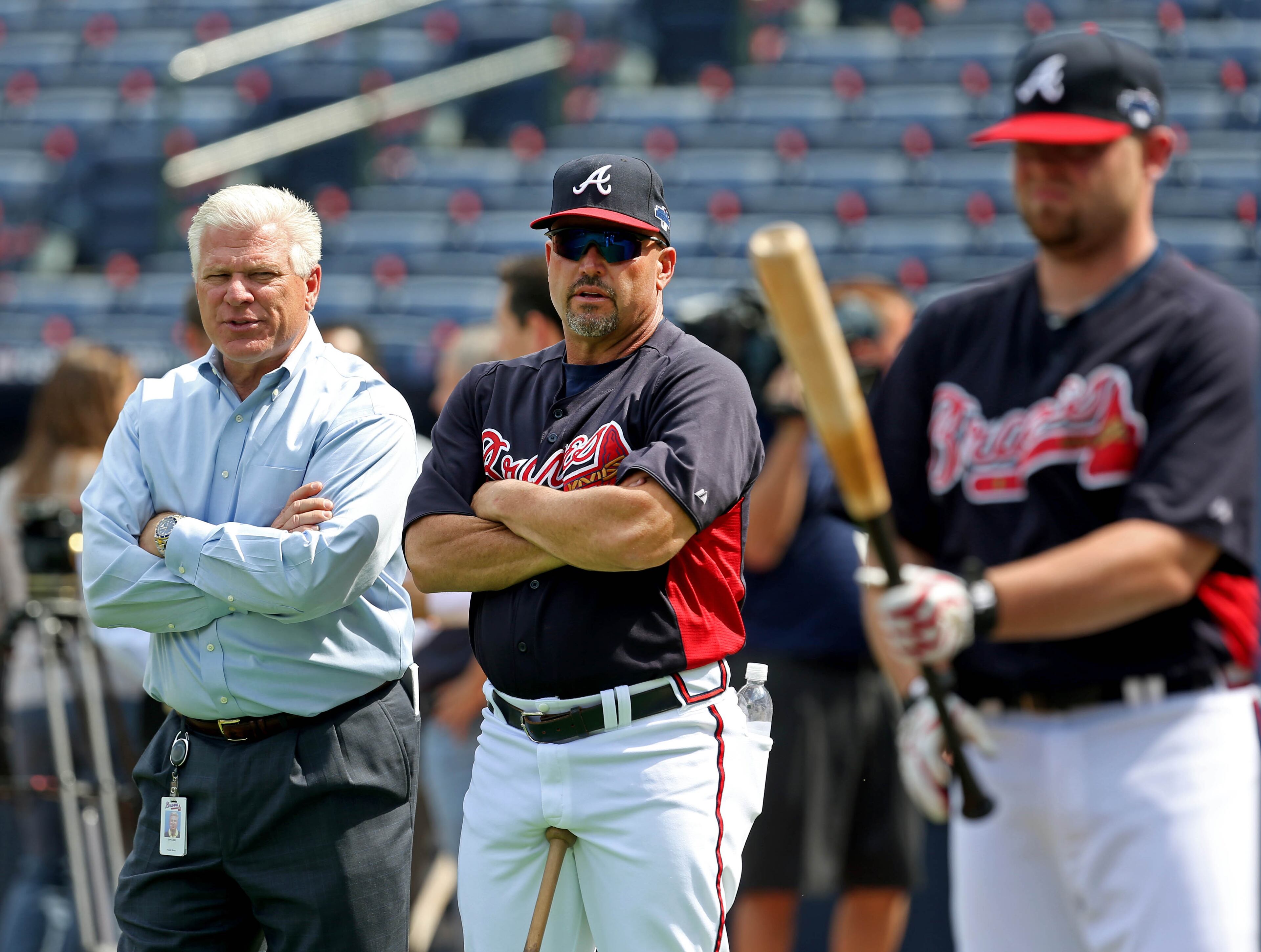 Atlanta Braves general manager Frank Wren, left, talks with manager Fredi Gonzalez as they watch batting practice in preparation for their NL Division Series against the Los Angeles Dodgers at Turner Field in Atlanta, Ga., October 2, 2013. The Atlanta Braves host the Los Angeles Dodgers in game 1 of the NL Division Series Thursday October 3, 2013 at 8:37pm.