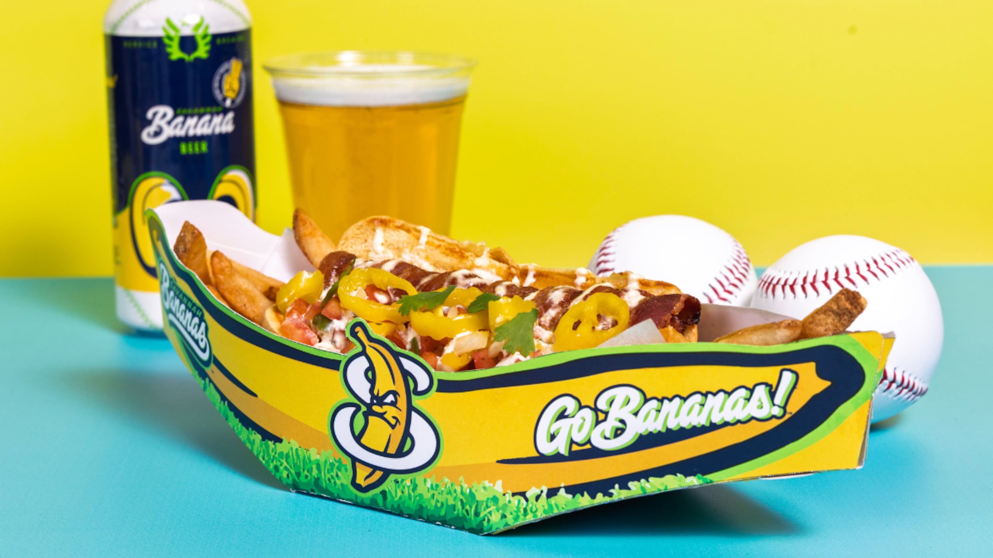 The Cuban-themed Havana Banana Hot Dog: A black angus beef hot dog wrapped in crispy bacon, topped with roasted banana peppers, Oaxaca cheese and fresh banana pepper pico de gallo, drizzled with banana pepper aioli on a soft bun. (Courtesy of Delaware North)