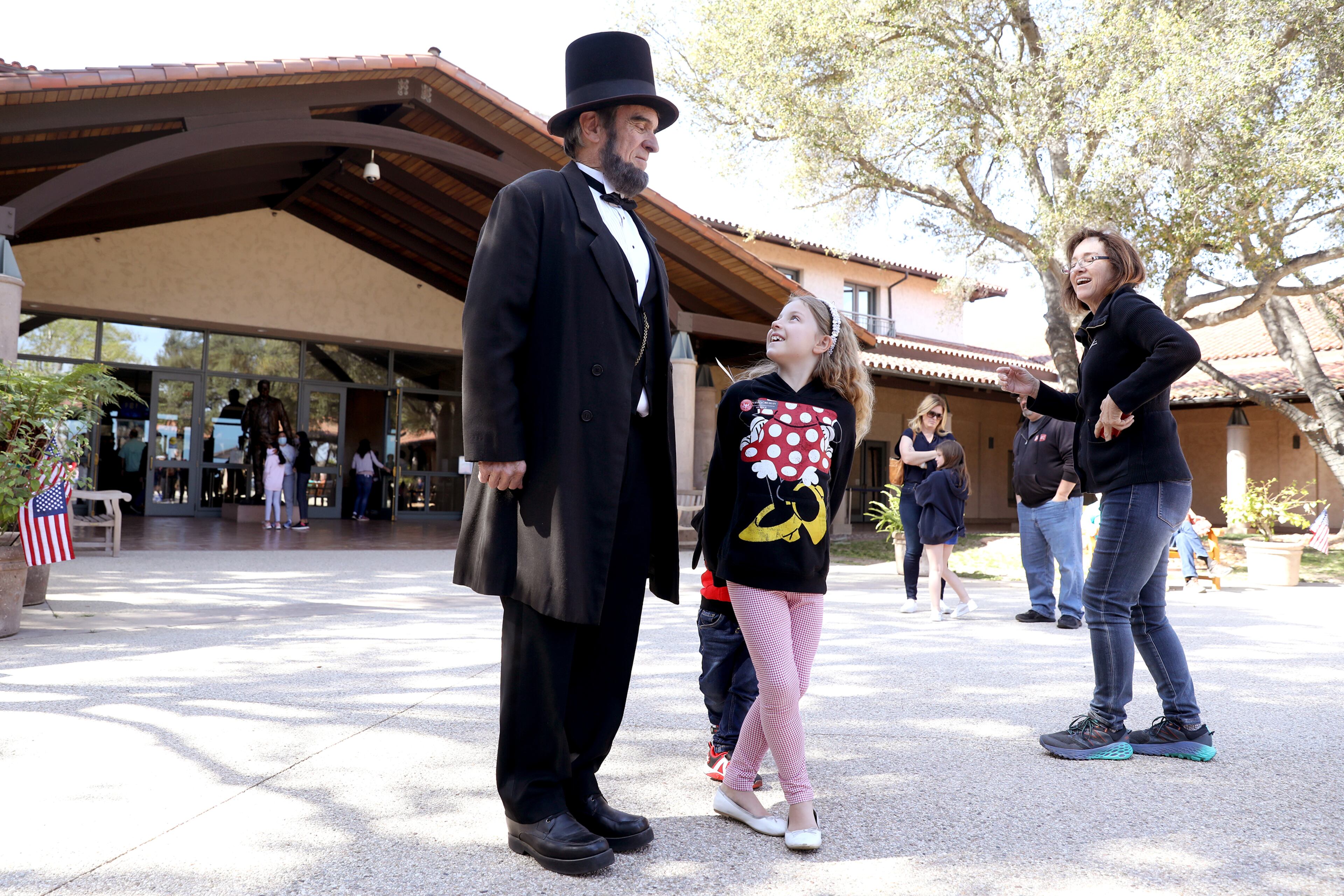 A man dressed as President Abraham Lincoln greeted visitors at the Ronald Reagan Presidential Library to mark Presidents Day in 2022 in Simi Valley, Calif.