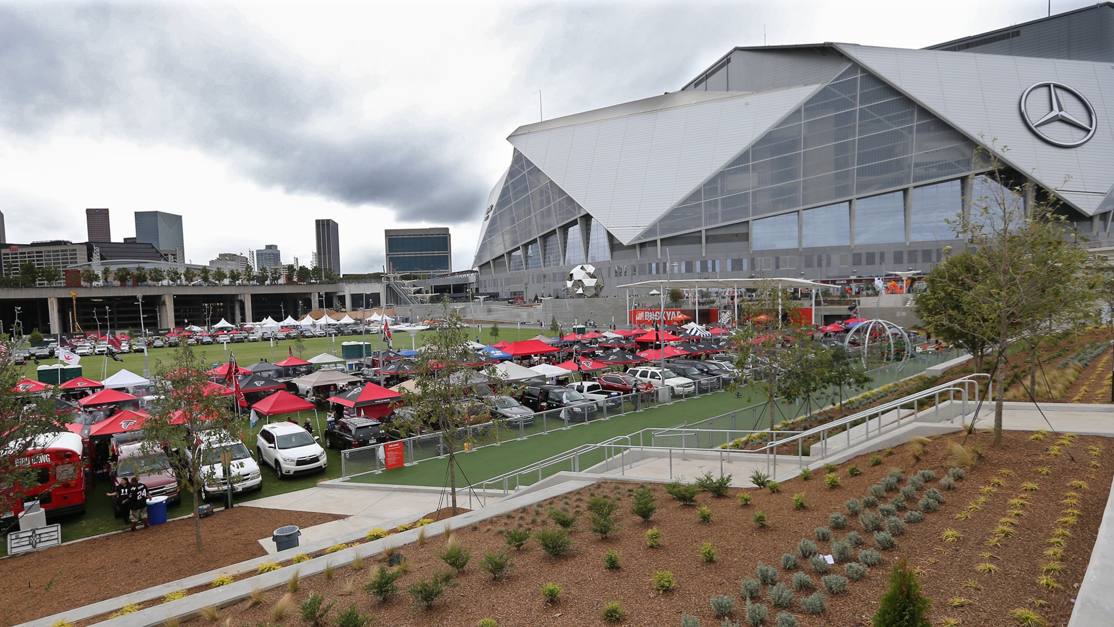 The parking lots around Mercedes-Benz Stadium will be filled with burnt orange and navy blue next September, as Auburn has agreed to move its Sept. 5, 2026, home game against Baylor to Atlanta as the Aflac Kickoff Game. (Curtis Compton/AJC 2018)