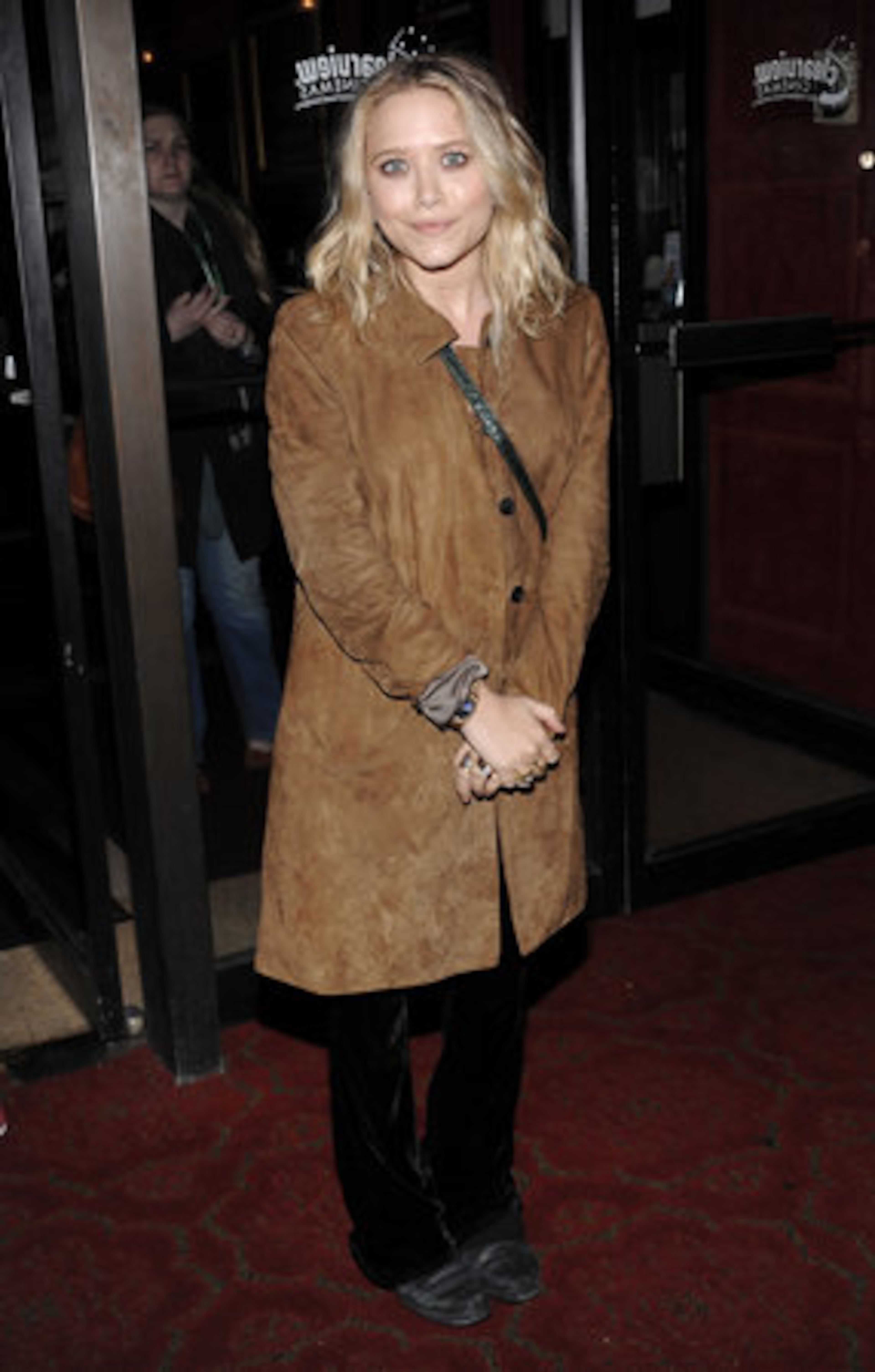 Mary-Kate Olsen, who is a member of the film festival jury, bundled up with a long brown suede coat. It's hard to stay warm when you're that thin.