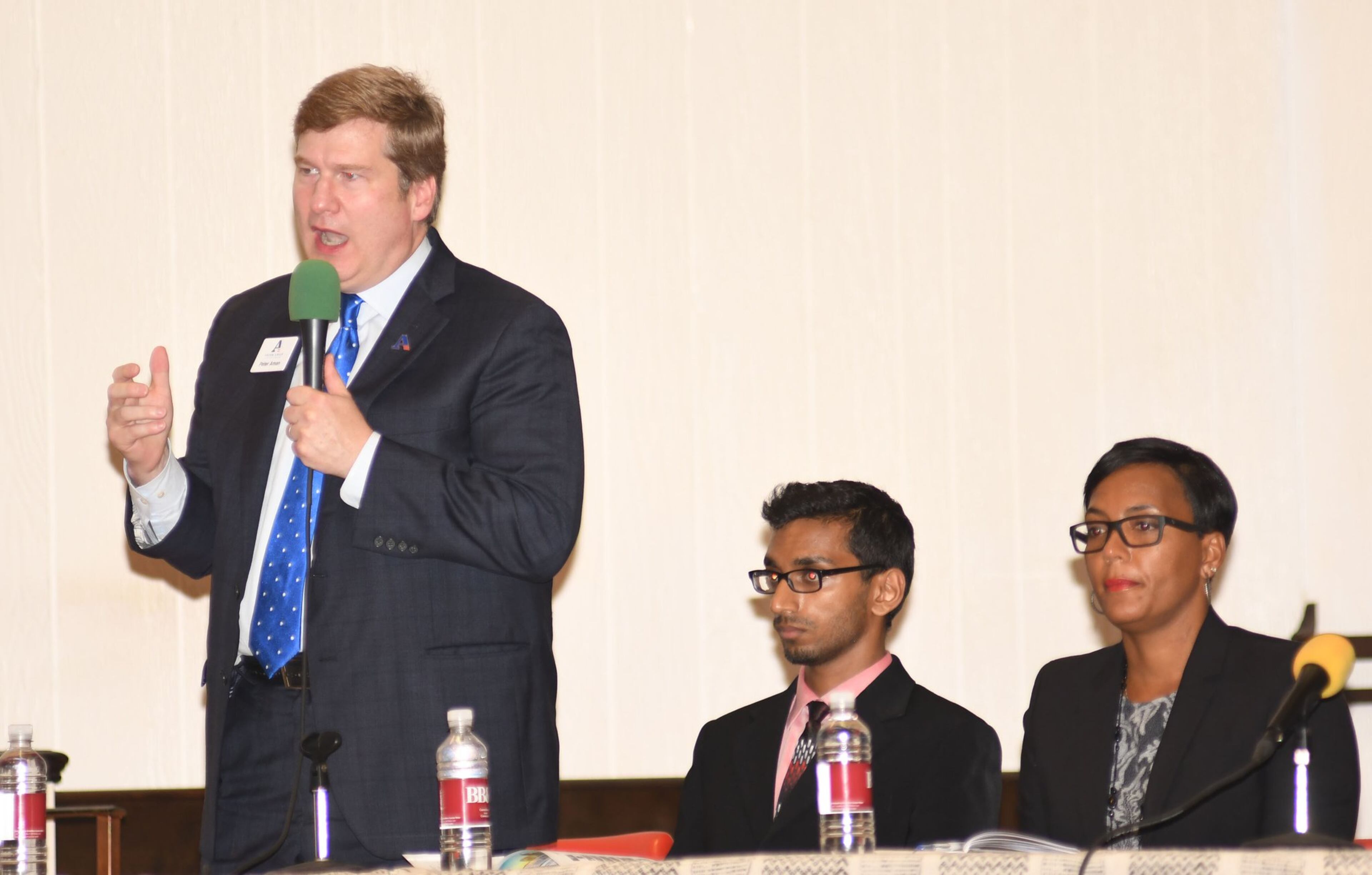 Peter Aman (left) speaks while Rohit Ammanamanchi (center) and Keisha Lance Bottoms (right) listen at the mayoral debate at The Shrine of the Black Madonna in Atlanta on Oct. 7, 2017. Black on Purpose TV hosted the mayoral debate. “The issue of race frames this election,” Aman said, pointing out that if elected, he would be the city’s first white mayor in decades. “It shouldn’t be the first issue and it shouldn’t be the only issue, but it should be discussed.” (Rebecca Breyer / Special to the AJC)