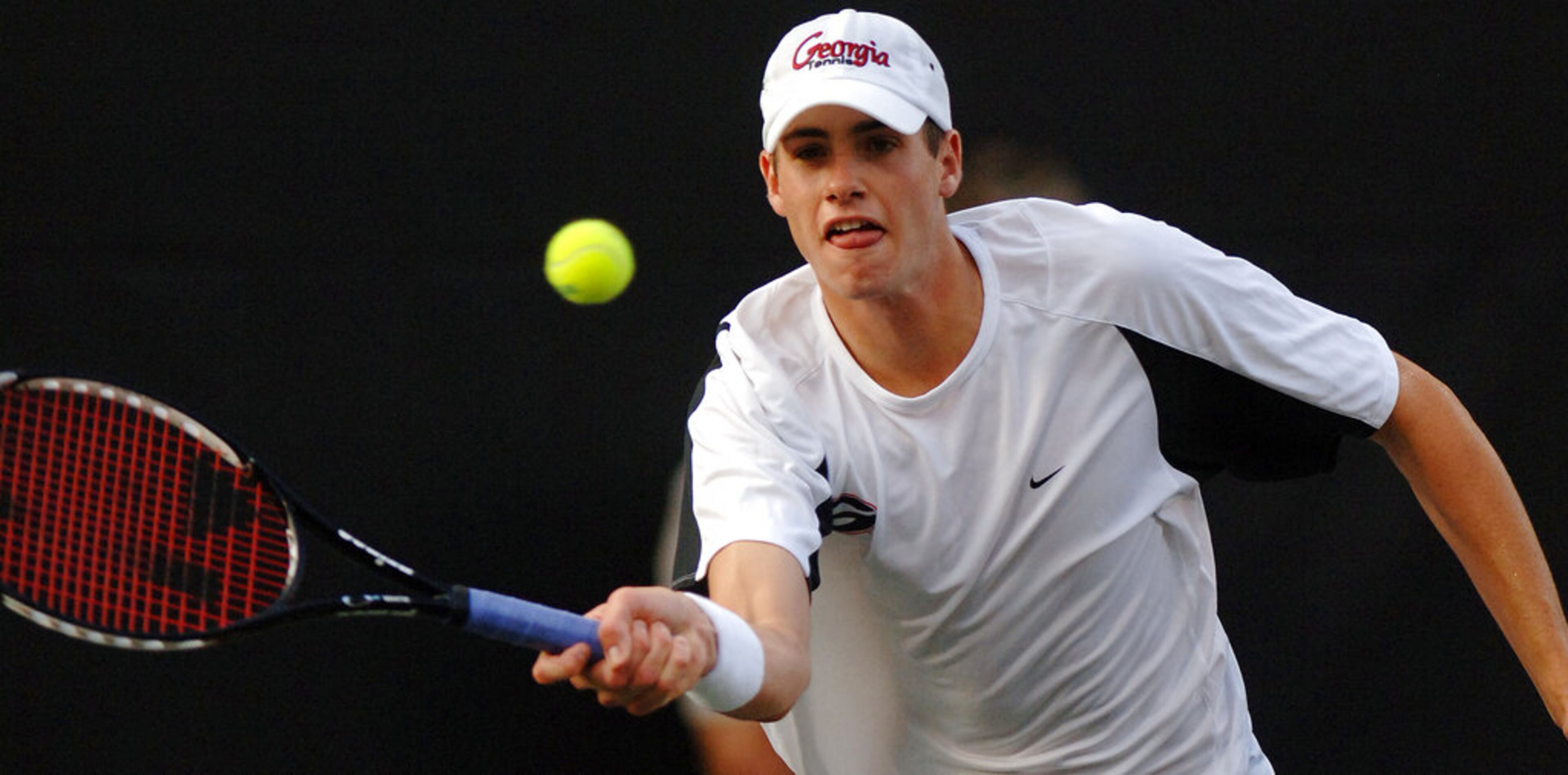Georgia's John Isner returns the ball against Virginia's Somdev Devvarman on Monday, May 28, 2007, during the NCAA men's singles tennis championship at the University of Georgia's Dan Magill Tennis Complex in Athens, Ga. Devvarman won in three sets, 7-6, 4-6, 7-6. (AP Photo/Athens Banner-Herald, Diane Cebula)
