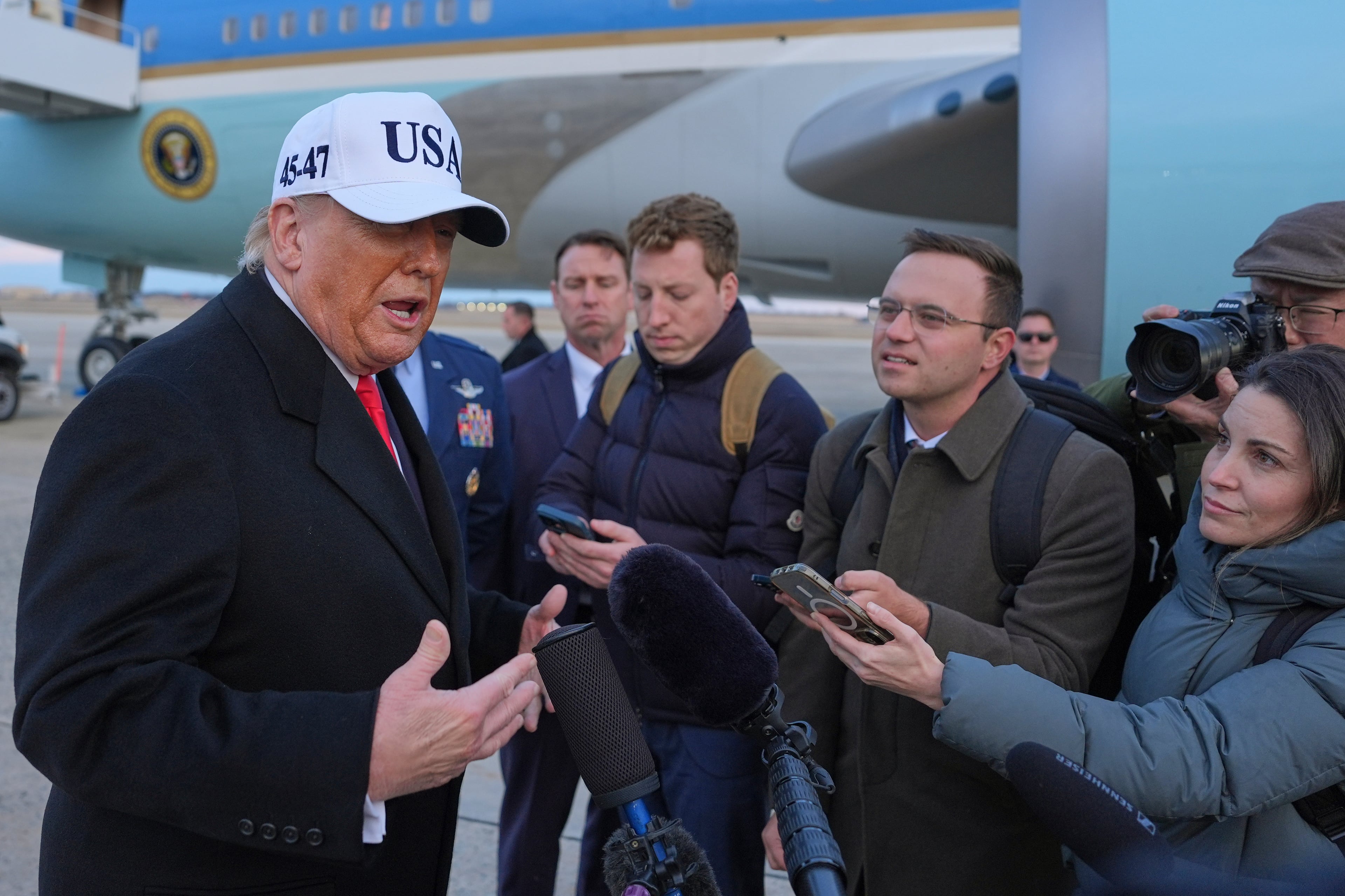 President Donald Trump spoke with reporters at Joint Base Andrews in Maryland on Tuesday. (Evan Vucci/AP)