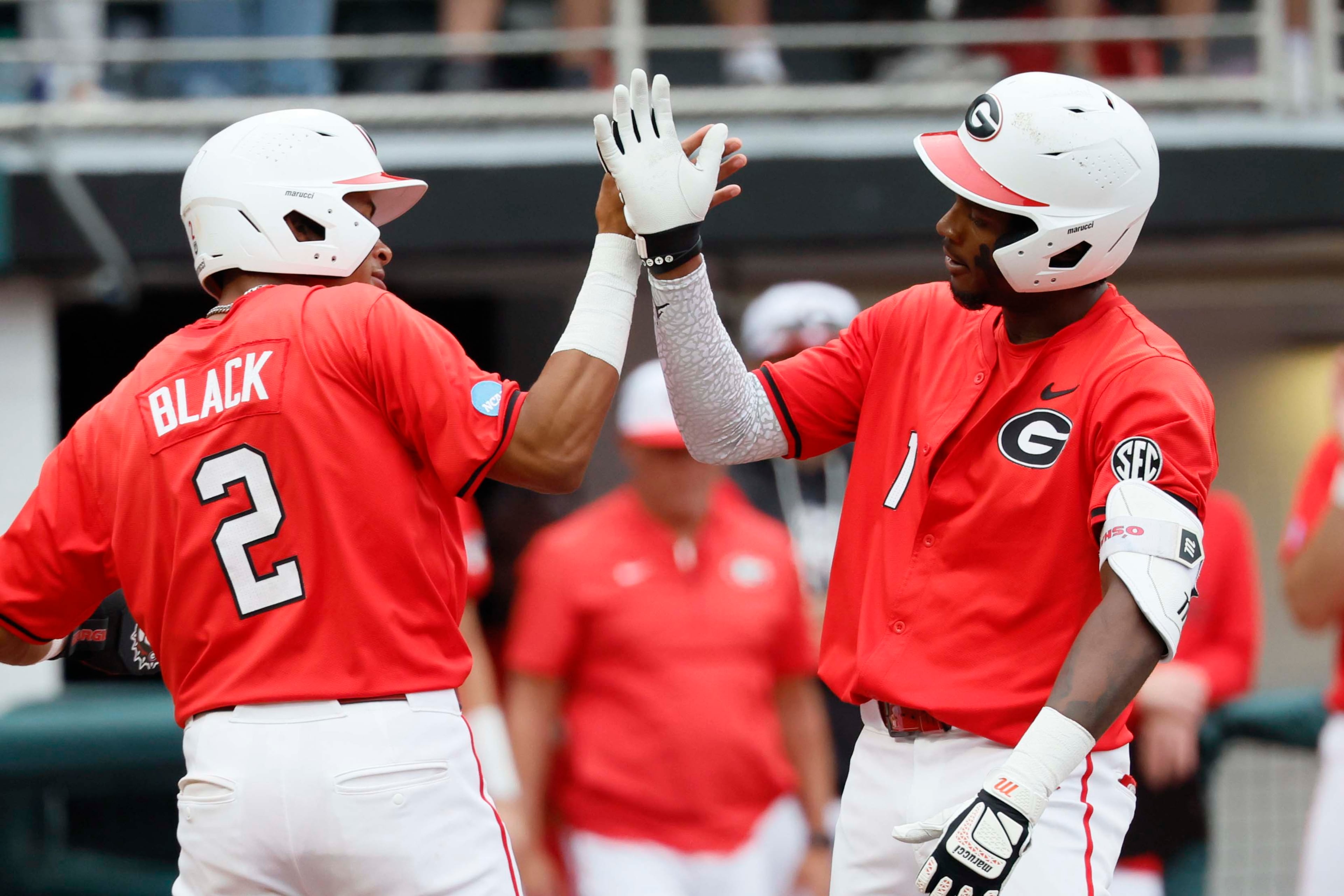 Georgia Bulldogs infielder Tre Phelps (1) celebrates with infielder Ryan Black (2) after hitting a two-run home run in the sixth inning of their NCAA Regional final game at Foley Field on Sunday, May 31, 2026, in Athens. (Miguel Martinez/AJC)