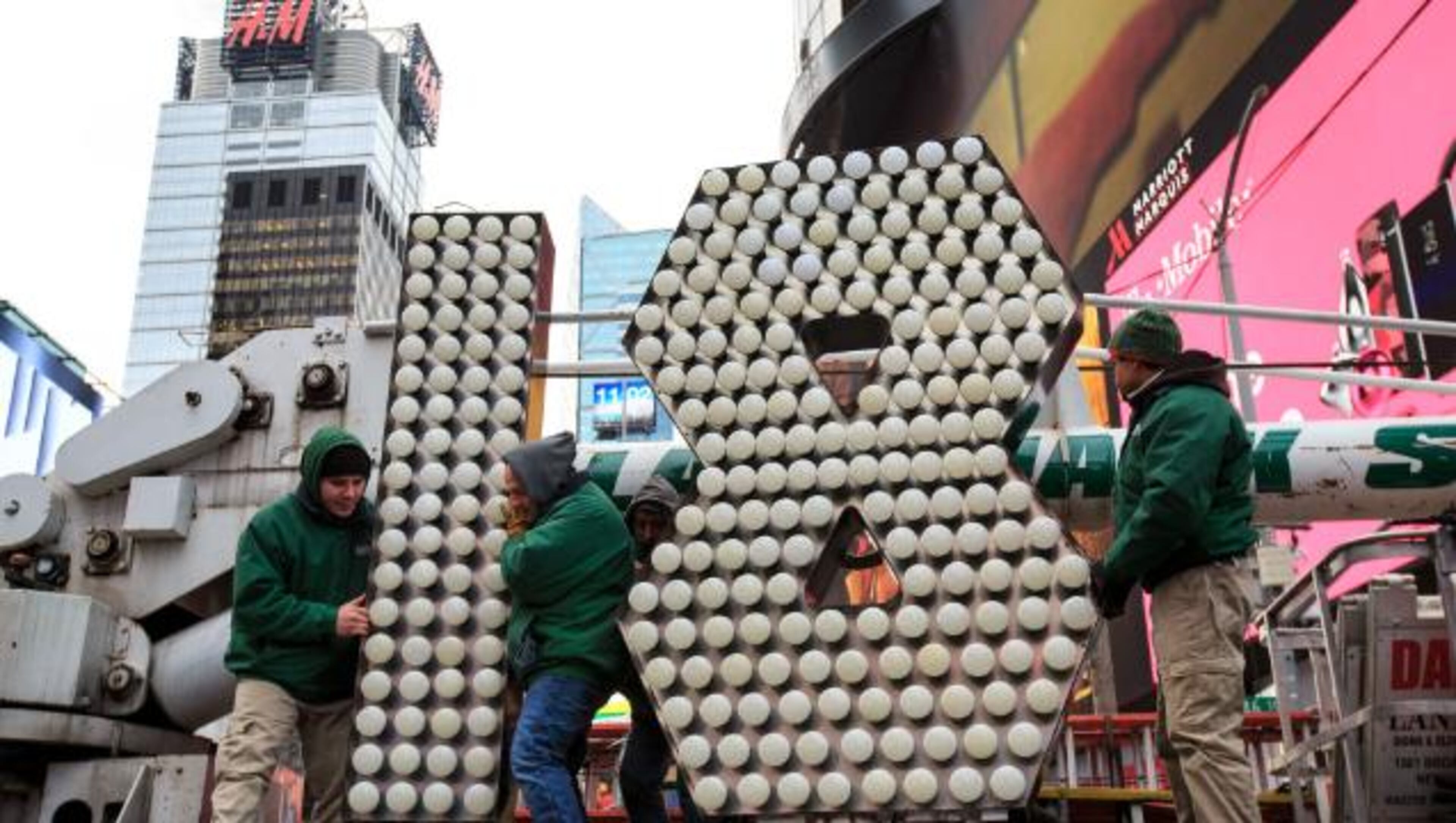 NEW YORK, NY - DECEMBER 13: Workers unload the numerals 1 and 8 as they arrive in Times Square ahead of the New Year's Eve celebration, December 13, 2017 in New York City. The '18' numerals will be part of the '2018' sign that will light up light up above Times Square at midnight on December 31 to ring in the new year. (Photo by Drew Angerer/Getty Images)