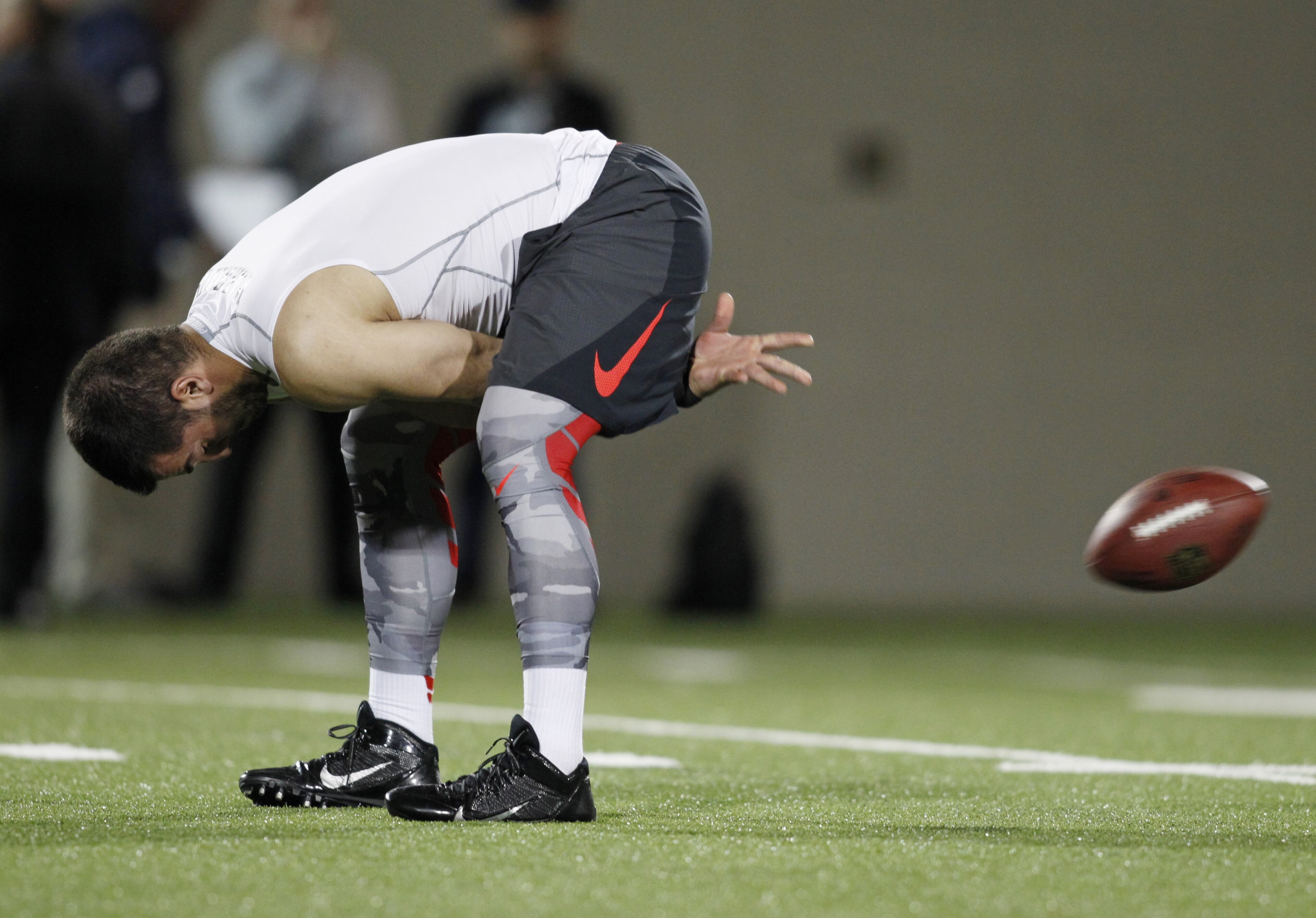 Long snapper George Makridis runs a drill during NFL Pro Day at Ohio State University in Columbus, Ohio, Friday, March 13, 2015. (AP Photo/Paul Vernon)