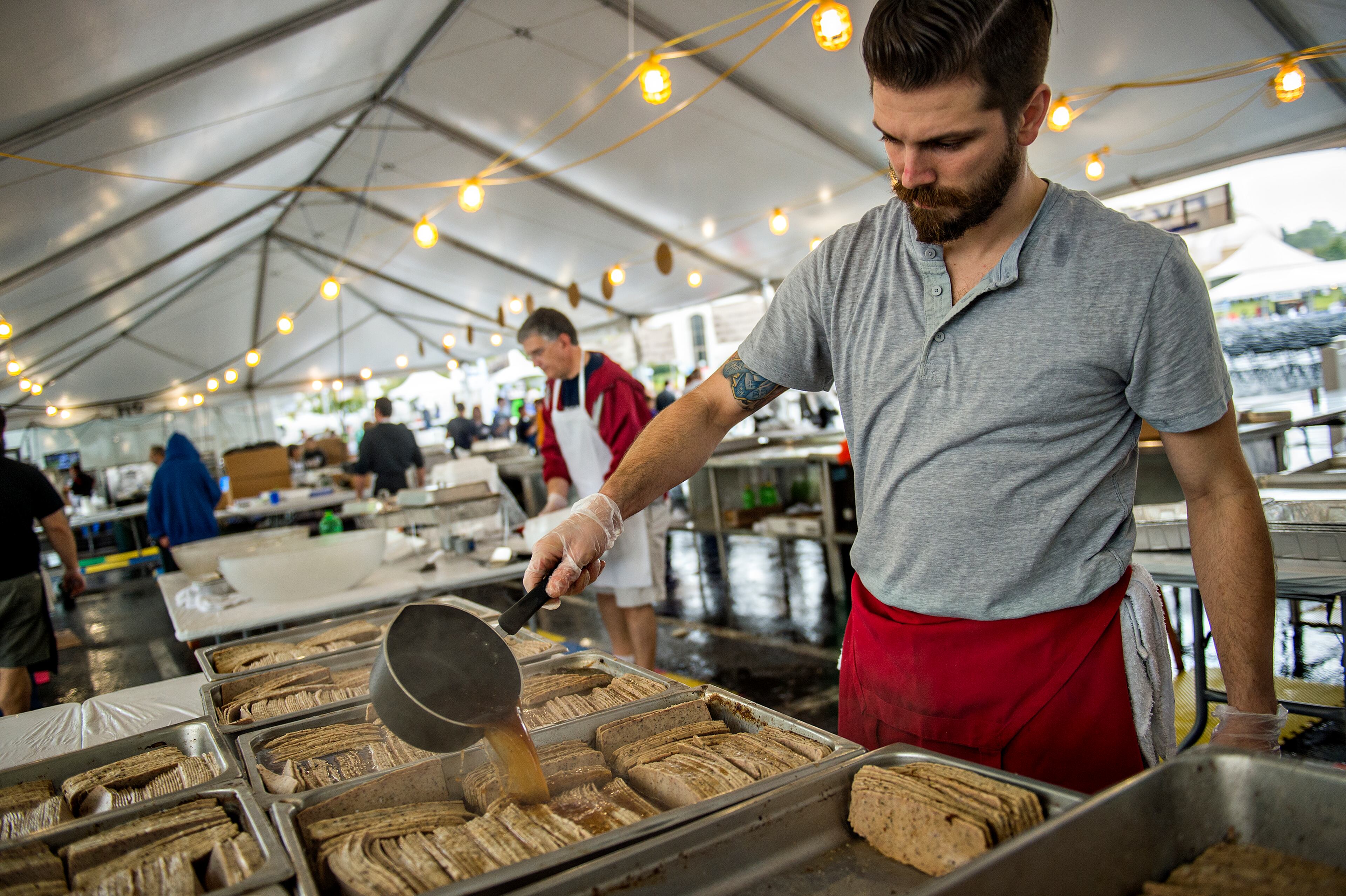 Peter Zakas Jr. marinates gyro meat during the Atlanta Greek Festival at the Greek Orthodox Cathedral of Annunciation on Saturday, September 26, 2015. The weekend long festival features everything Greek from food, shopping, performances, live music and tours of the church. JONATHAN PHILLIPS / SPECIAL