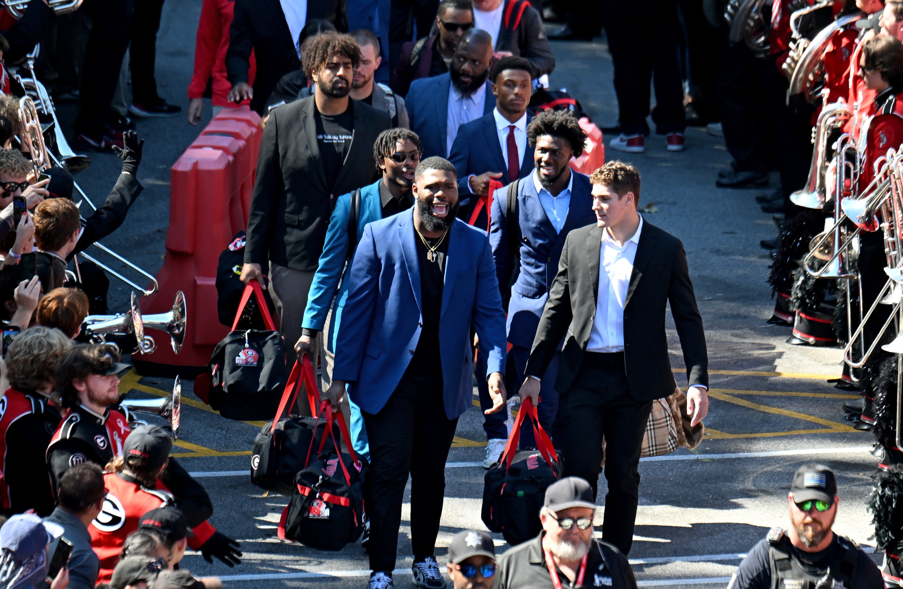 Georgia players and staff arrive during Dawgs Walk before their game against Mississippi State at Sanford Stadium, Saturday, October 12, 2024, in Athens. (Hyosub Shin / AJC)