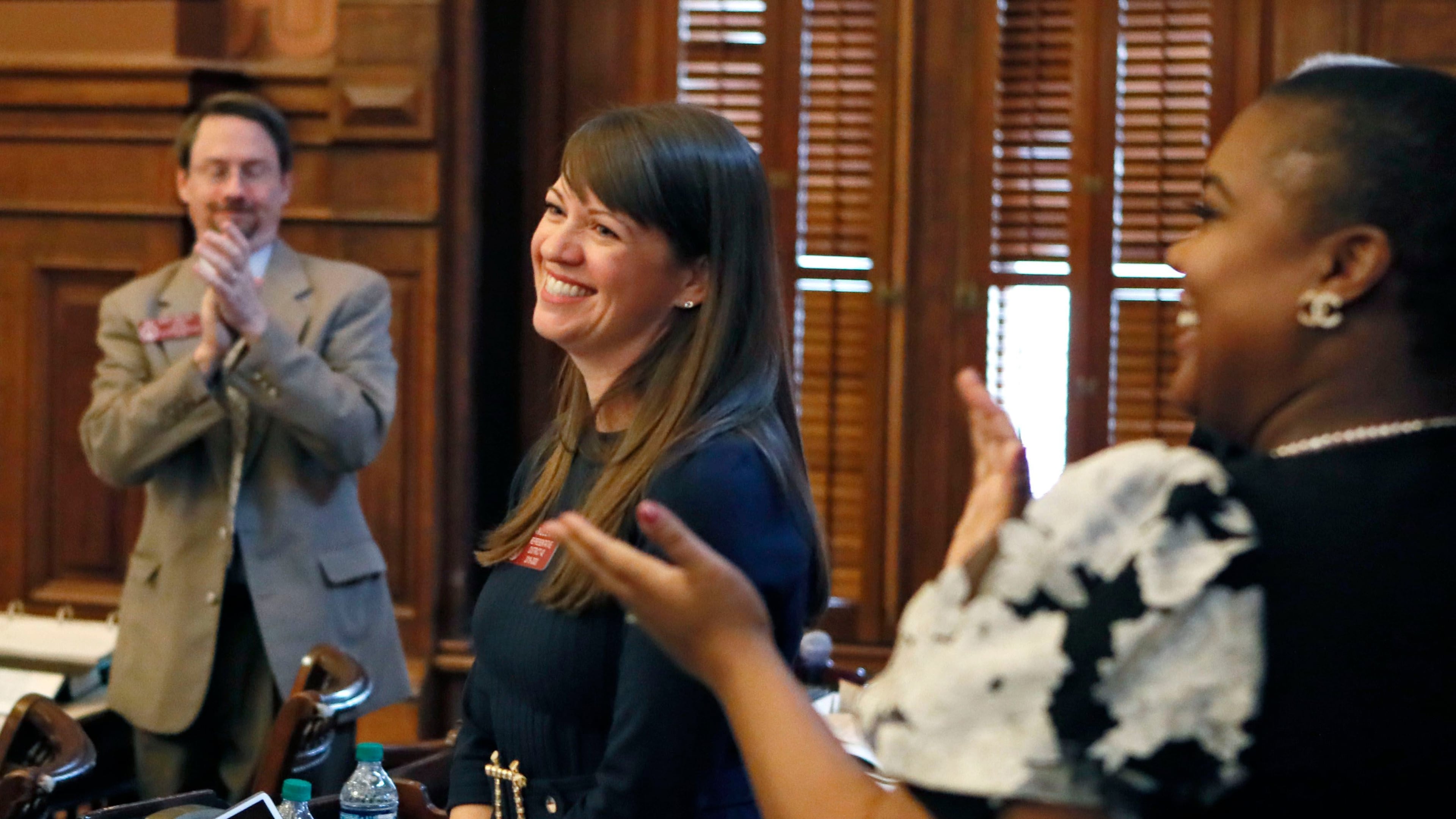 Rep. Teri Anulewicz (D-Smyrna) is congratulated after her first bill passed the house, March 1, 2019. (Bob Andres/The Atlanta Journal-Constitution/TNS)