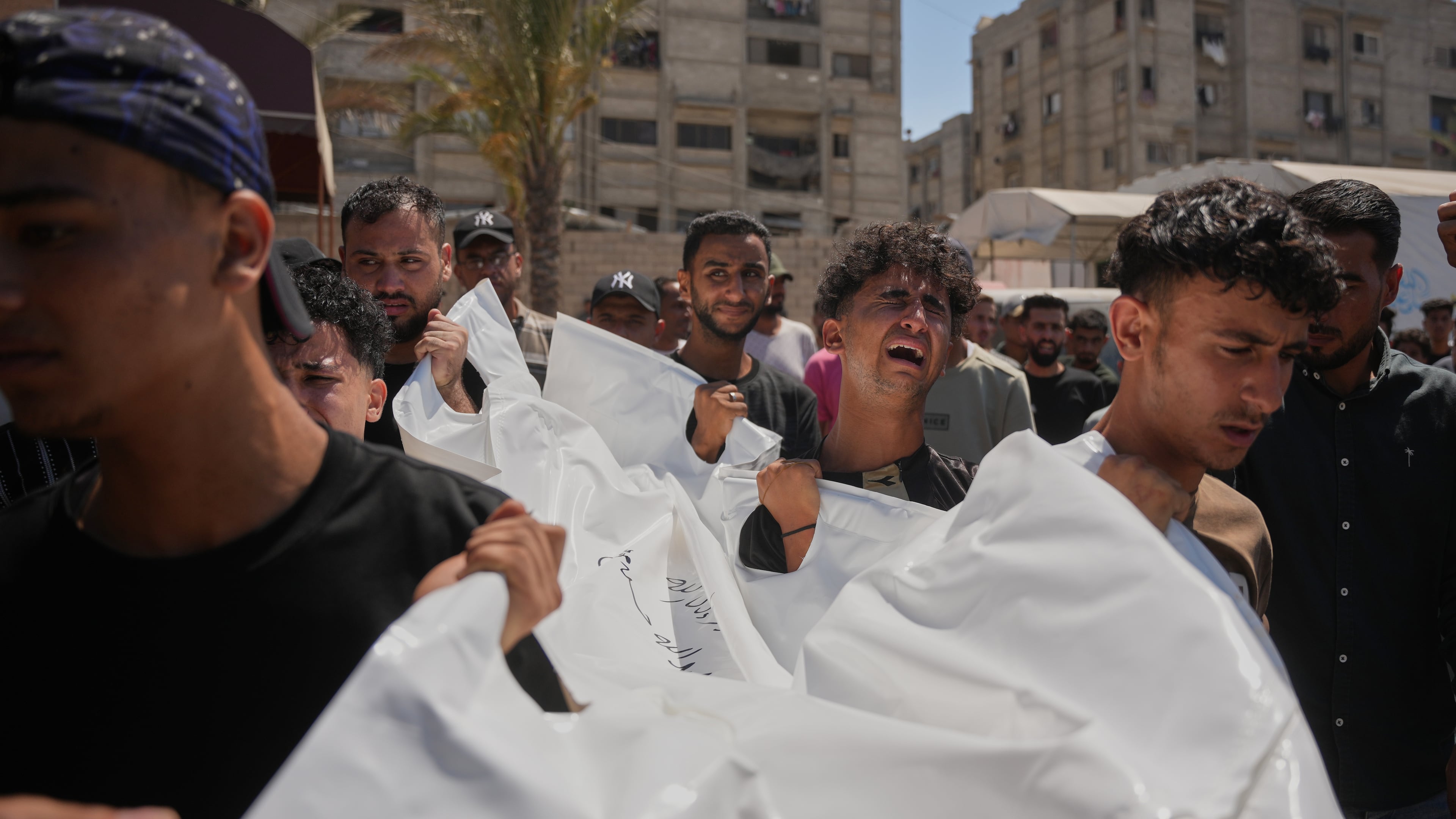 Mourners carry the body of Palestinian Abdullah Moussa, 30, who was killed in an Israeli airstrike, during his funeral in Khan Younis, southern Gaza Strip, Saturday, June 27, 2026. (AP Photo/Abdel Kareem Hana)