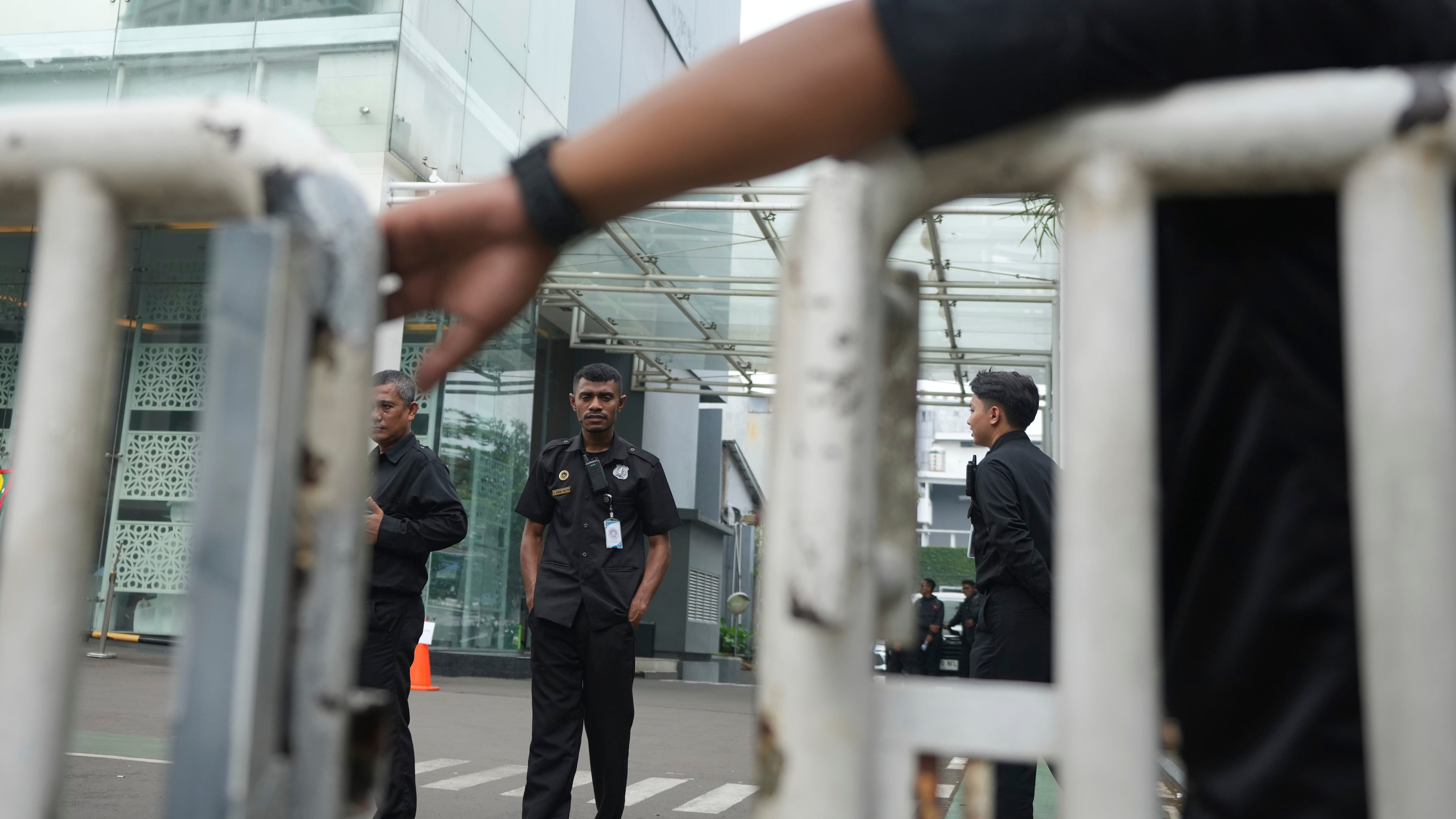 Security personnel guard the entrance of the office of the National Nutrition Agency as it is being searched by prosecutors, in Jakarta, Indonesia, Wednesday, June 3, 2026. (AP Photo/Dita Alangkara)