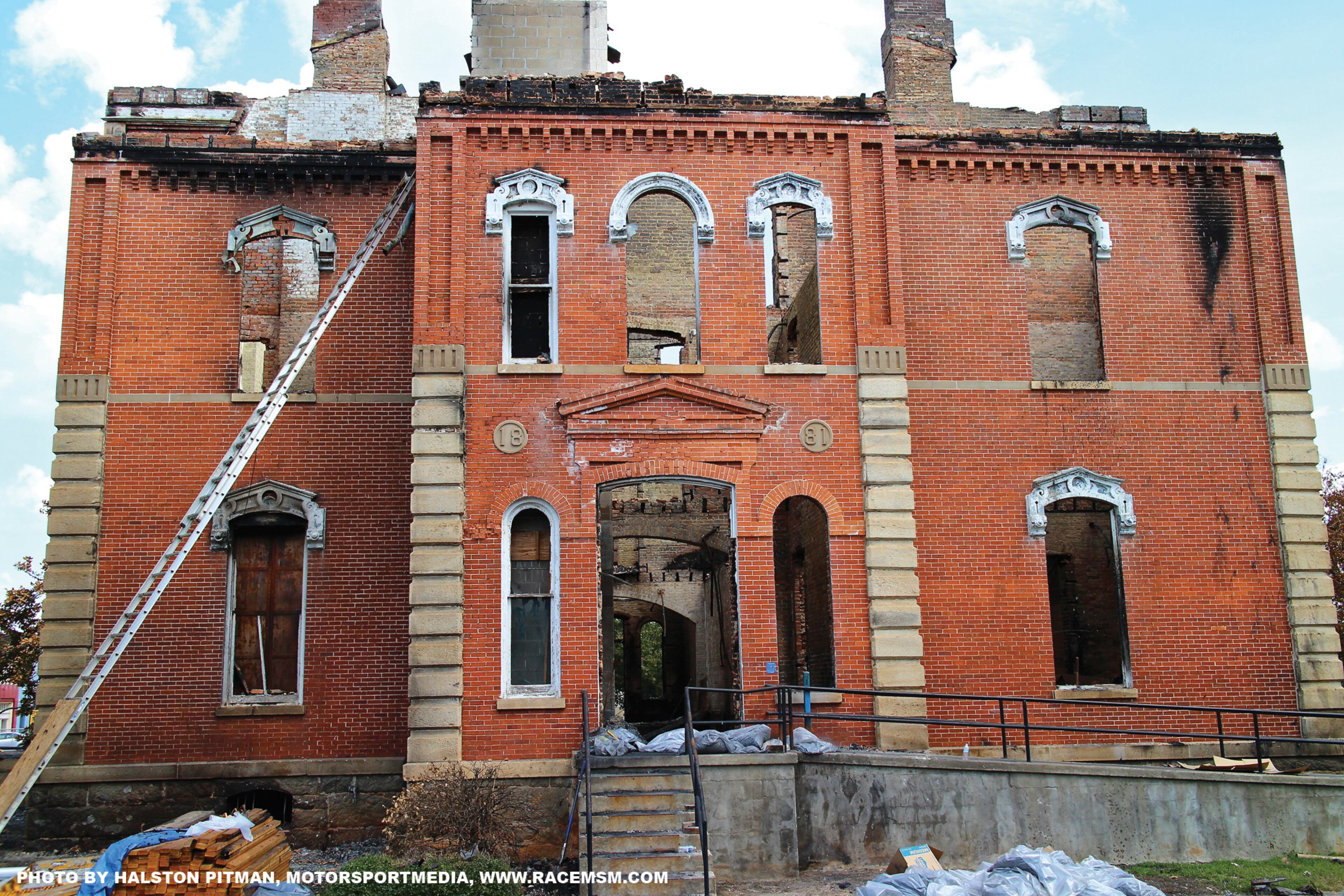 Listed as a 2013 Place in Peril, the Hancock County Courthouse was built in 1883. The courthouse was well known for its red brick façade and prominent clock tower. After suffering from decline due to a lack of funding for maintenance, the county had recently started $150,000 worth of exterior renovations. In August, a fire ripped through the courthouse, destroying the famed clock tower and leaving only the exterior brick walls standing. The county will be forced to relocate its business in the short term as it works with insurance adjusters, architects, engineers and contractors to rebuild the courthouse with the inclusion of modern upgrades necessary for today's county courthouse.