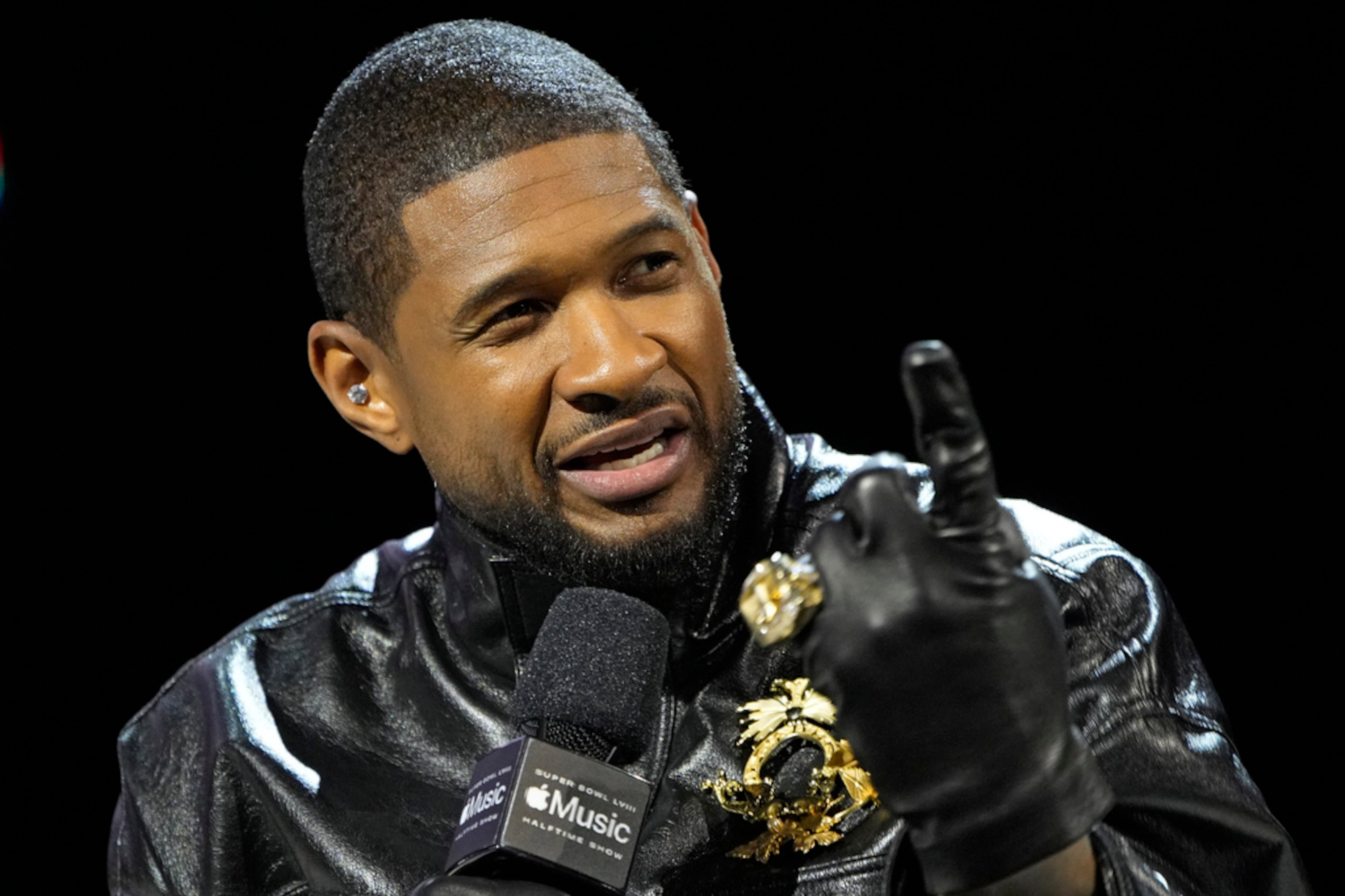 Usher speaks during a news conference ahead of the Super Bowl 58 NFL football game Thursday, Feb. 8, 2024, in Las Vegas. Usher will perform during the Super Bowl halftime show. (AP Photo/John Locher)