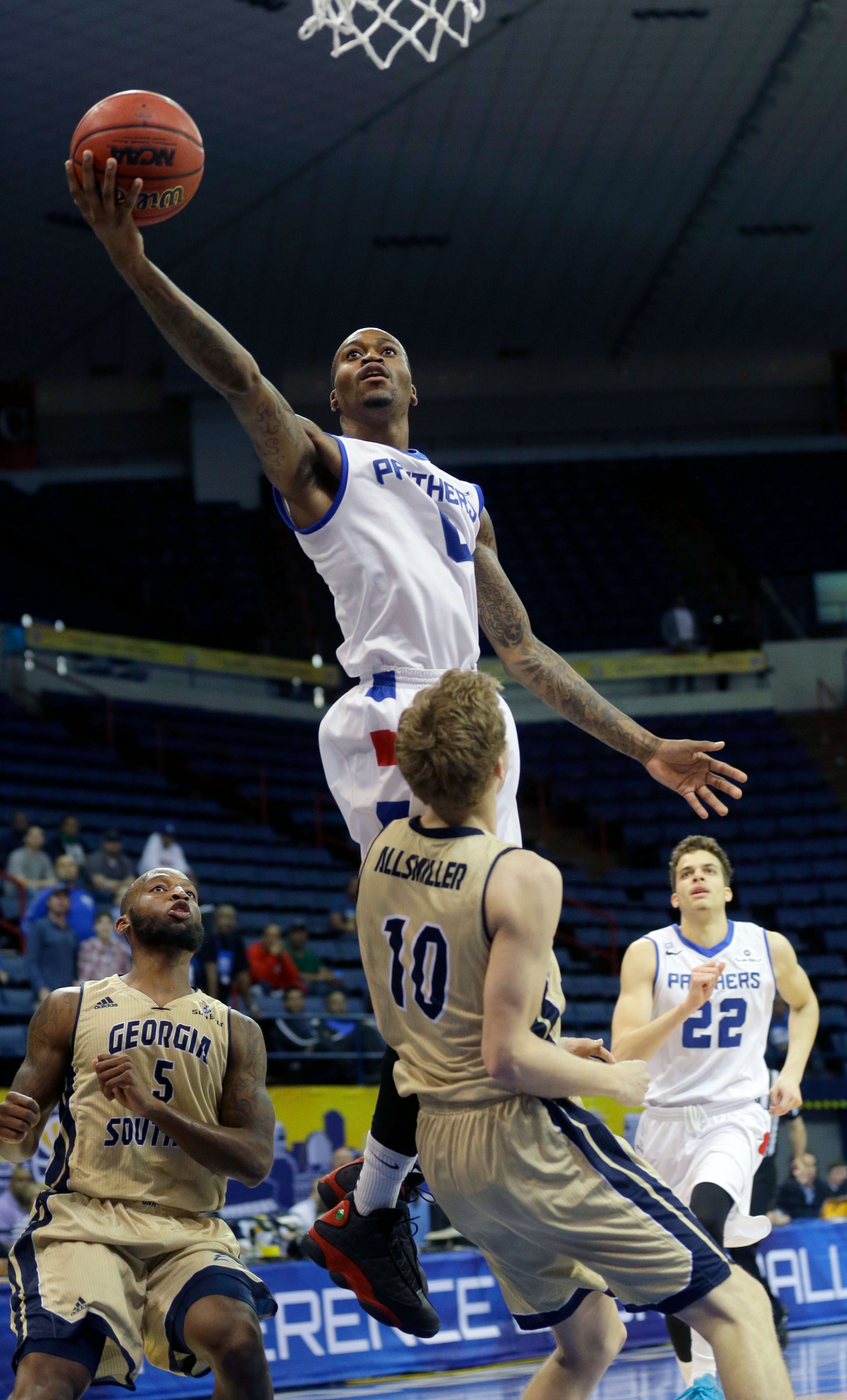 Georgia State guard Kevin Ware (0) goes to the basket over Georgia Southern guard Jake Allsmiller (10) in the first half of an NCAA college basketball game in the championship of the Sunbelt Conference tournament in New Orleans, Sunday, March 15, 2015. (AP Photo/Bill Haber)