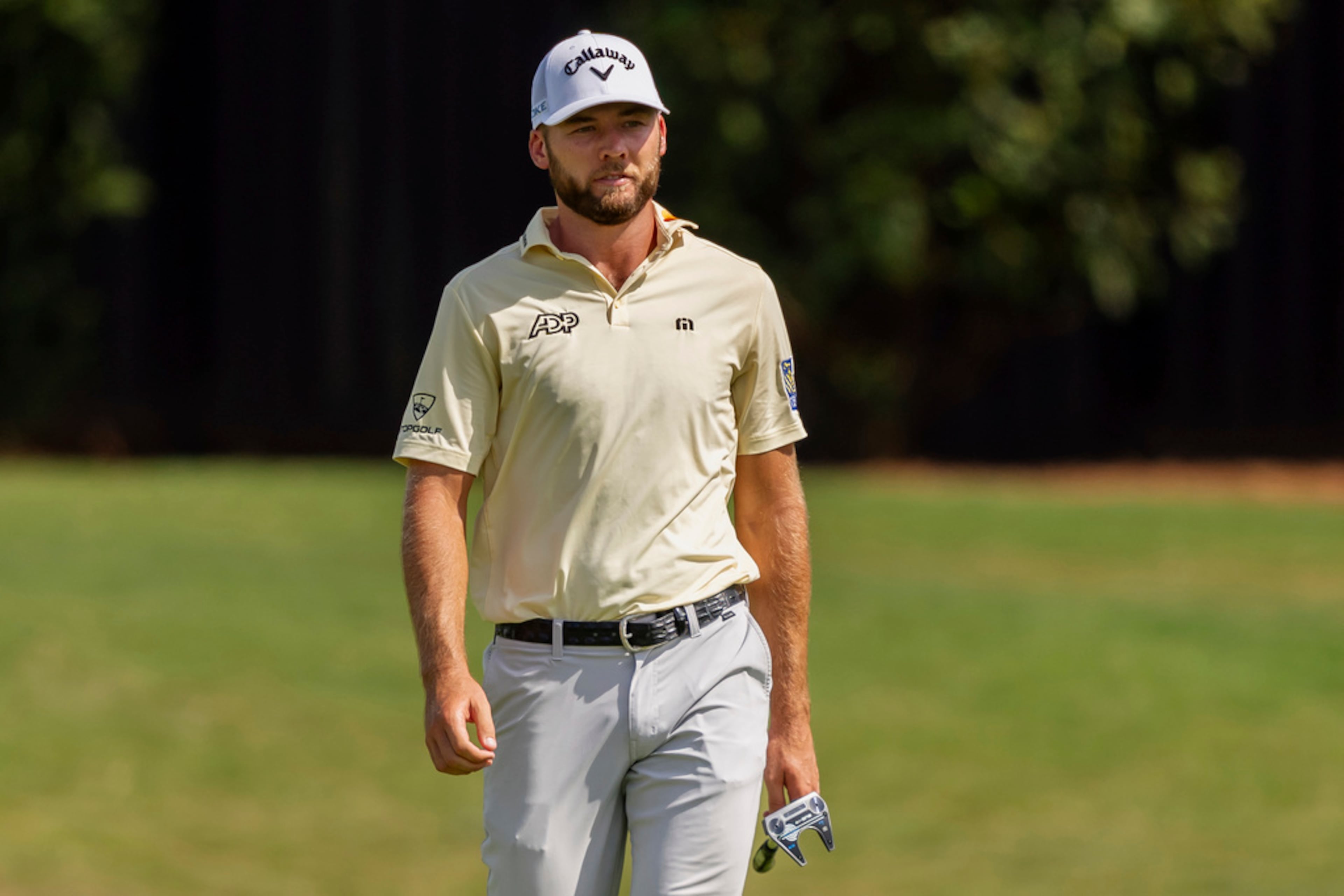 Sam Burns checks his line on the green of hole number seven during the third round of the Tour Championship golf tournament, Saturday, Aug. 31, 2024, in Atlanta. (AP Photo/Jason Allen)