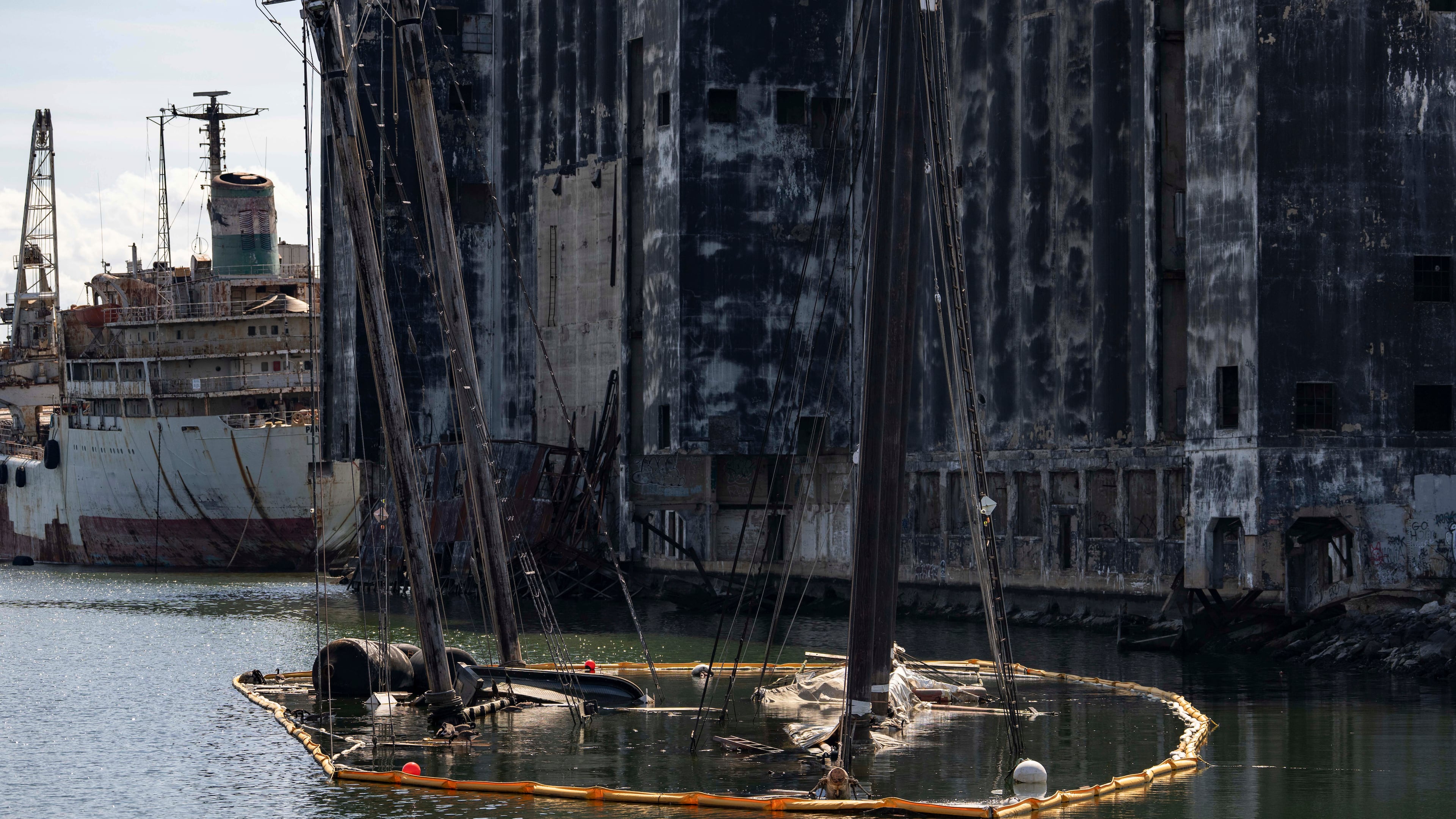 Debris of the Victory Chimes and the Pilot floats in the Henry Street Basin, Wednesday, Aug. 26, 2026, in the Brooklyn borough of New York. (AP Photo/Yuki Iwamura)