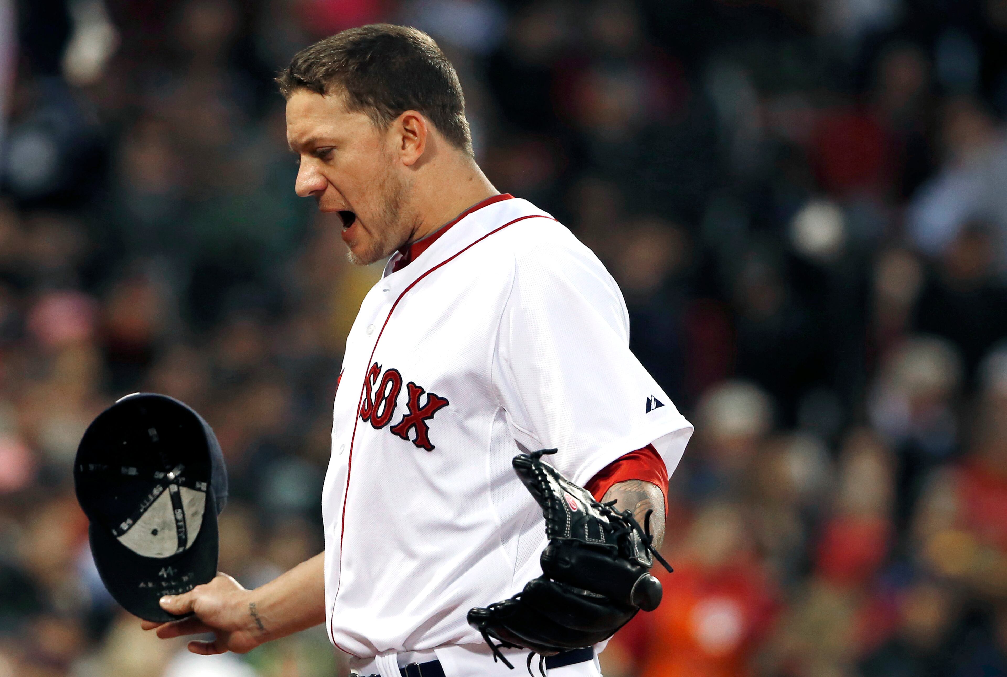 Boston Red Sox starting pitcher Jake Peavy heads to the dugout after committing a balk which led to an Atlanta Braves run during the fourth inning of a baseball game at Fenway Park, Thursday, May 29, 2014, in Boston. (AP Photo/Winslow Townson)