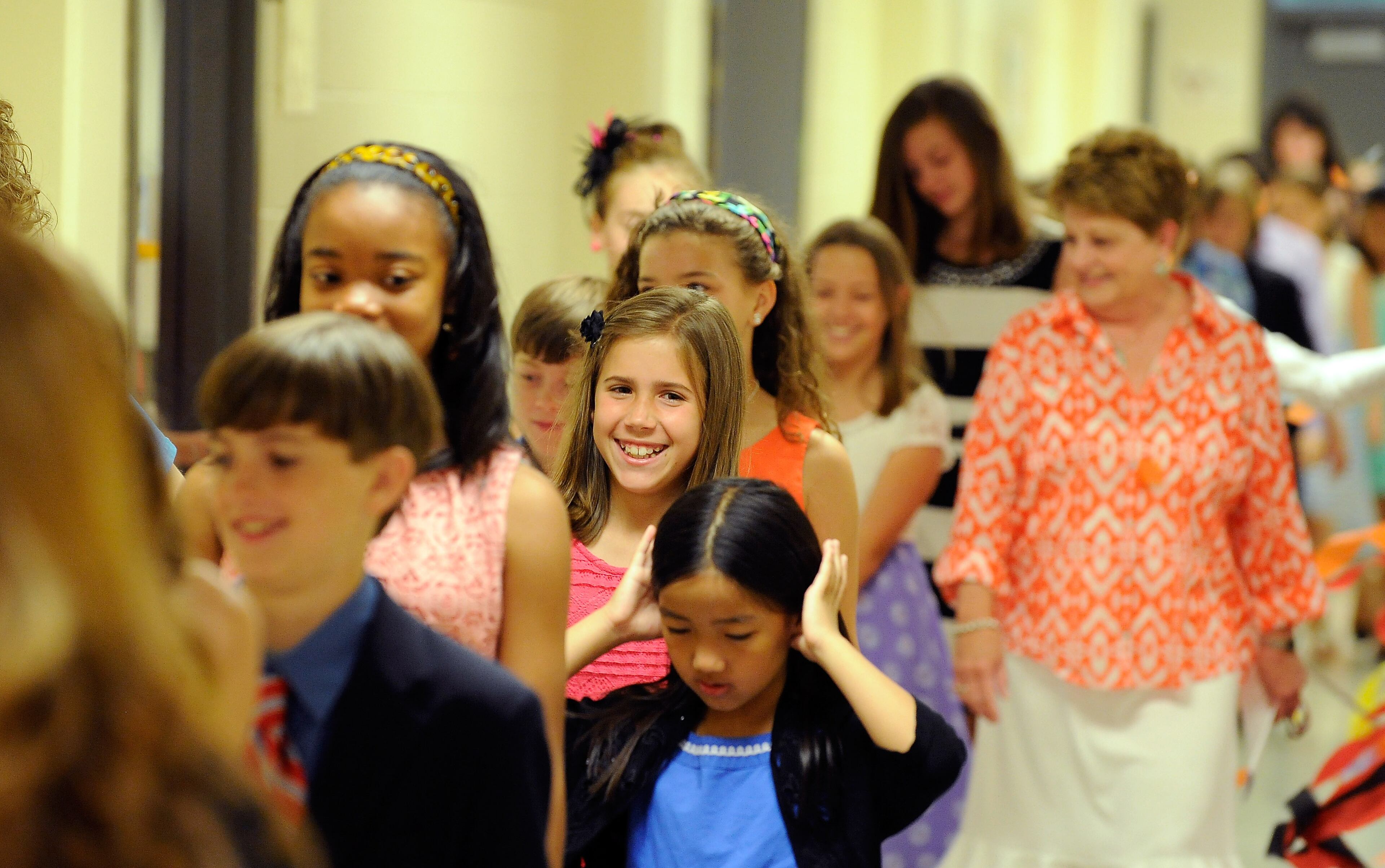 Alpharetta Elementary School fifth graders participate in a school tradition as they walk the hallways one last time to celebrate their graduation to middle school, Friday, May 23, 2014, in Alpharetta, Ga. David Tulis / AJC Special