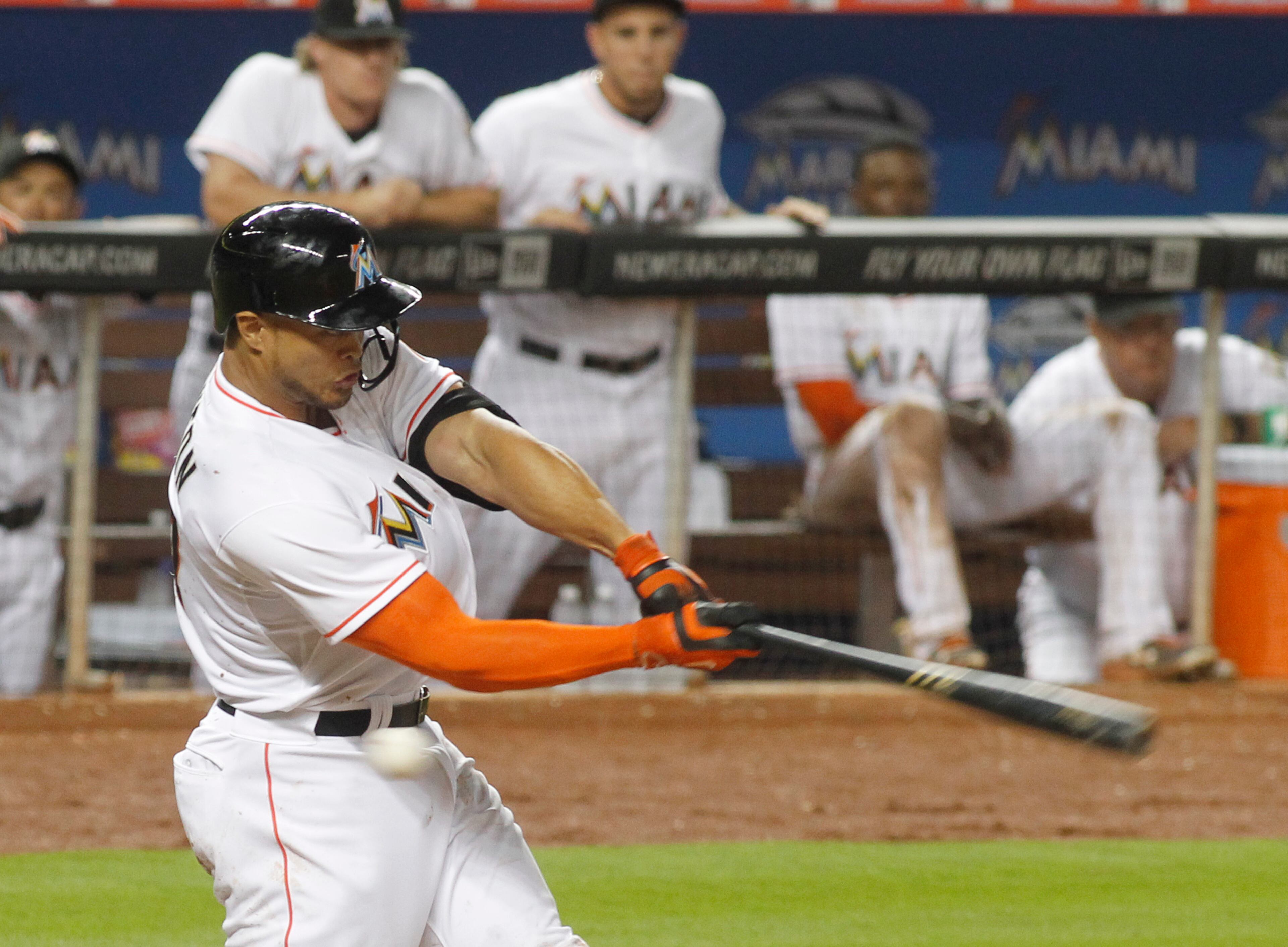 Miami Marlins right fielder Giancarlo Stanton stikes out in the ninth inning of the Marlins 2-1 loss to the Atlanta Braves in their opening day baseball game in Miami, Monday, April 6, 2015. (AP Photo/Joe Skipper)