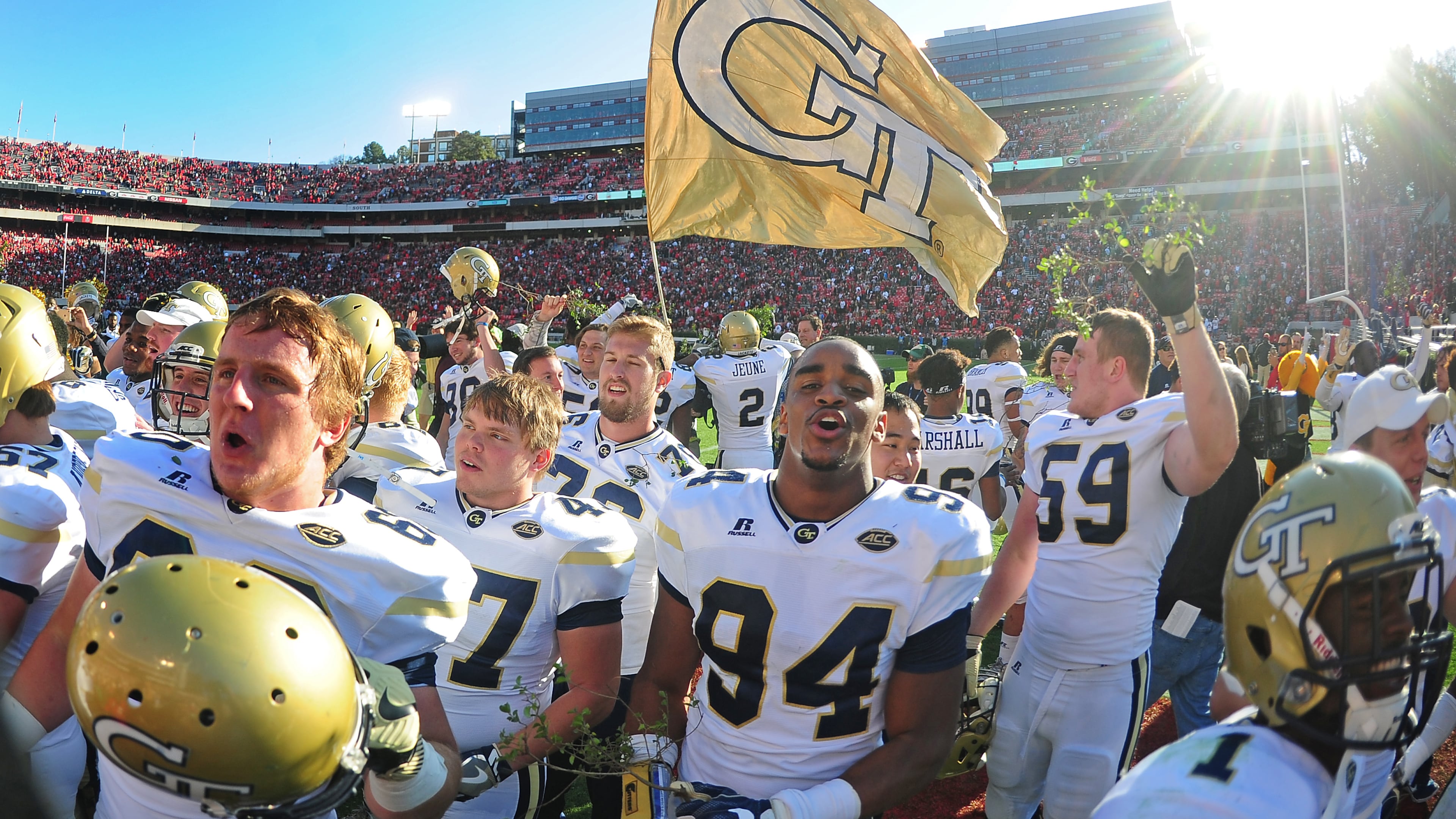 ATHENS, GA - NOVEMBER 26: Members of the Georgia Tech Yellow Jackets celebrate after the game against the Georgia Bulldogs at Sanford Stadium on November 26, 2016 in Athens, Georgia. (Photo by Scott Cunningham/Getty Images)