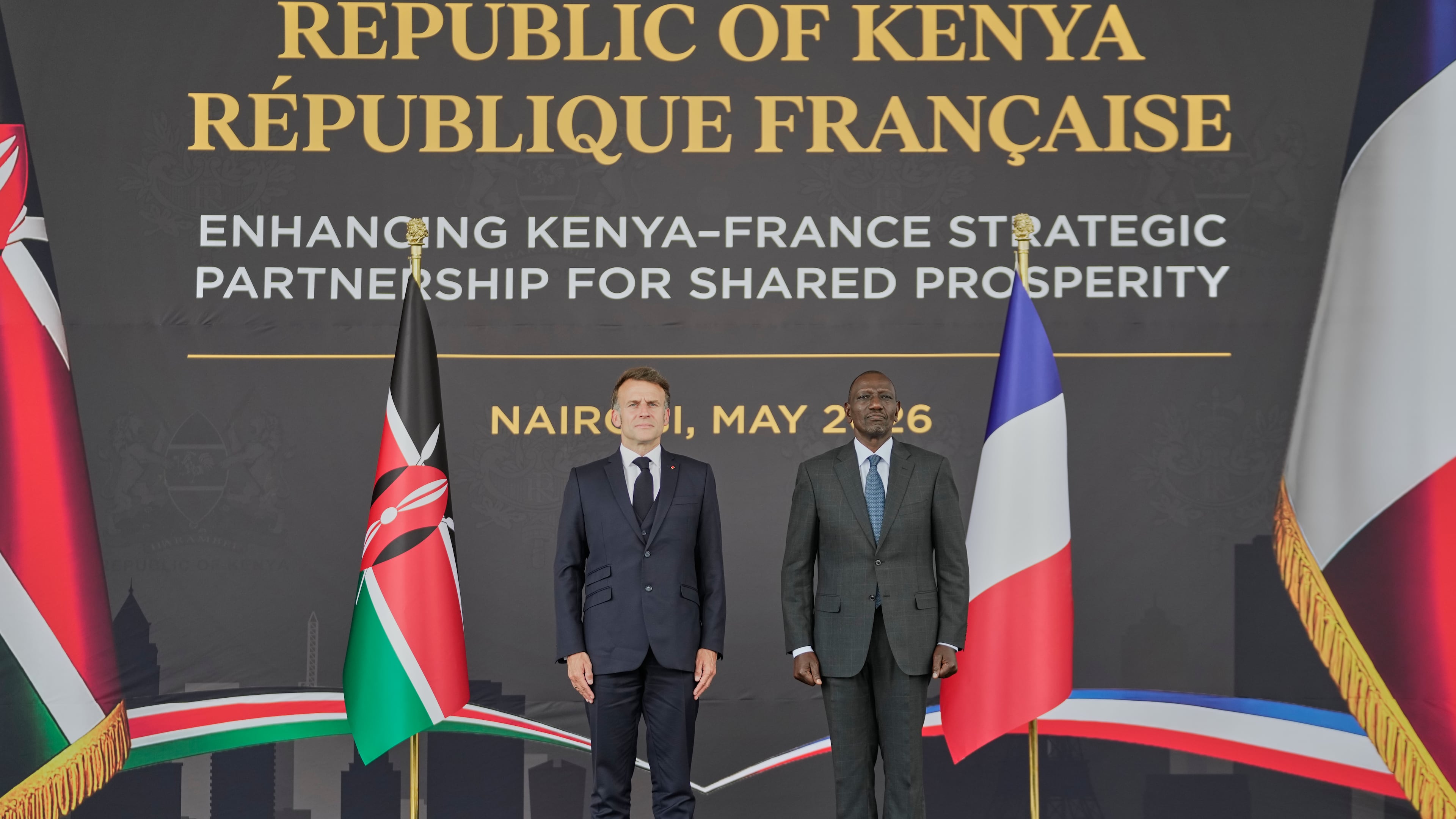 France's President Emmanuel Macron, left, and Kenya's President William Ruto stand during the national anthem at State House in Nairobi, Sunday, May 10, 2026. (AP Photo/Brian Inganga)