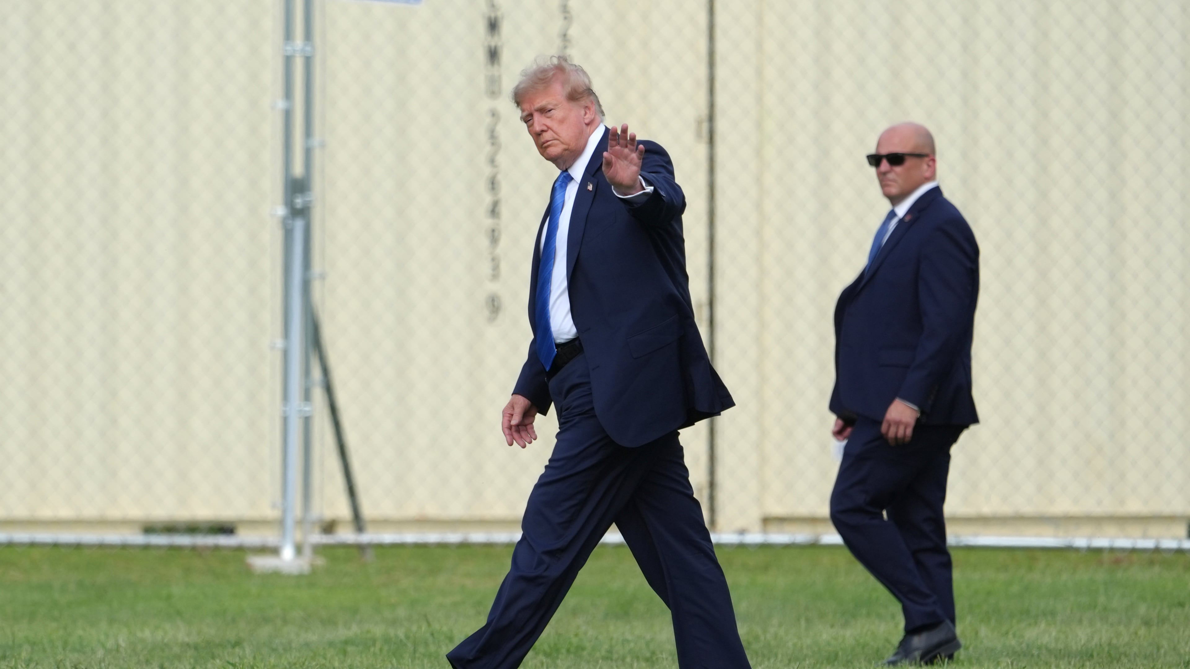 President Donald Trump walks to board his presidential limousine after arriving on Marine One from the Ellipse near the White House, Friday, Aug. 28, 2026, in Washington, on return from Houston. (AP Photo/Jacquelyn Martin)
