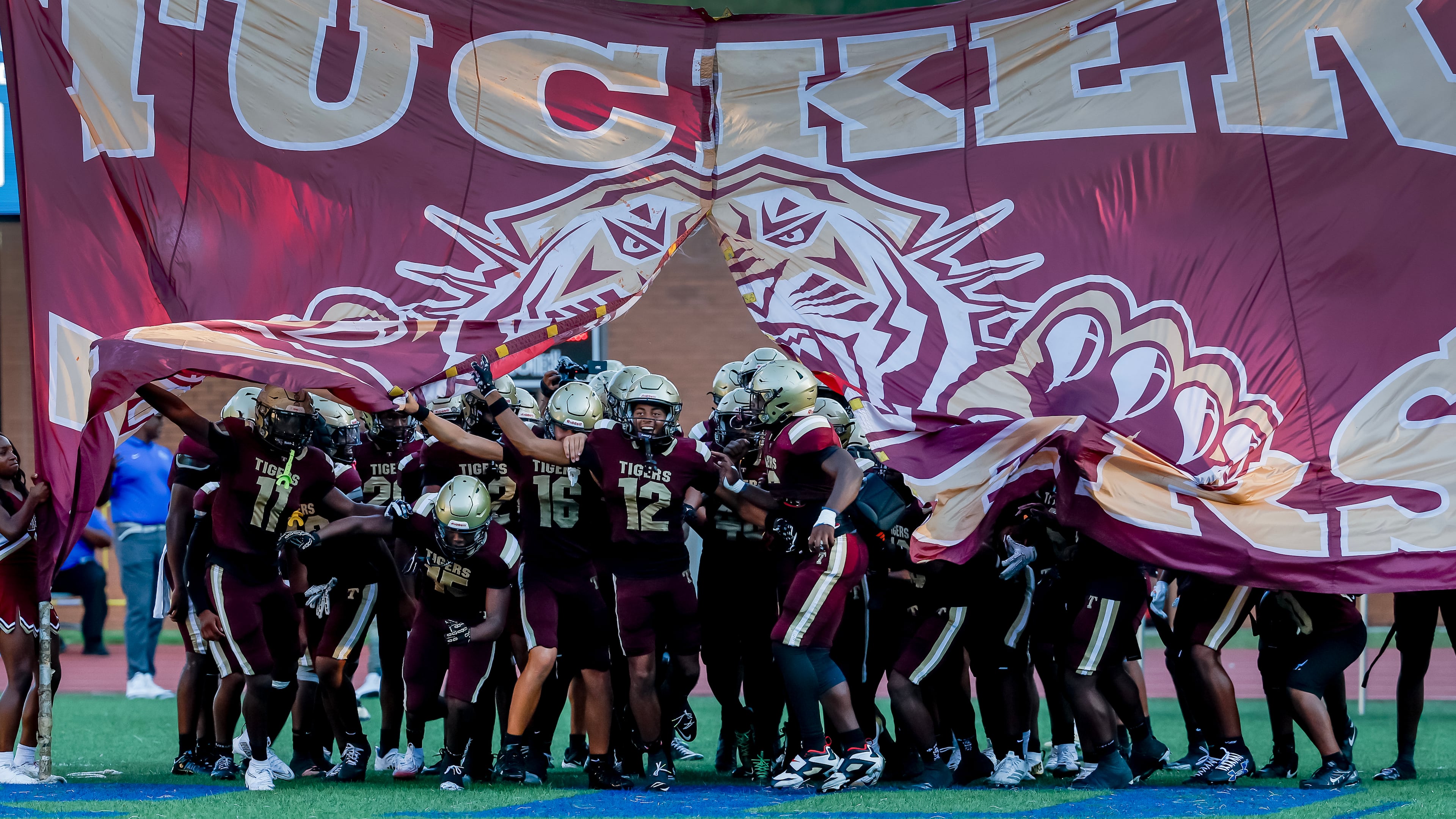 Tucker enters the field before the first half of a high school football game against Stephenson at Hallford Stadium on Sept. 4, 2026. (Erik S. Lesser for the AJC)