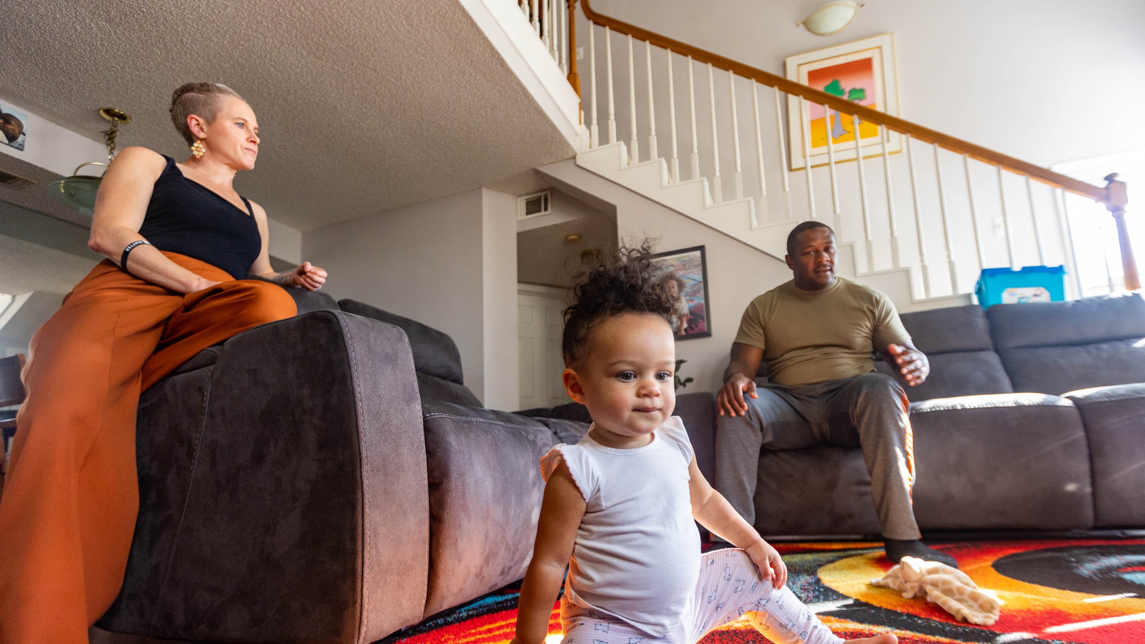 Akil Sanders, right, with his wife, Stefanie, and their daughter, Nola, in their Old Fourth Ward home. Not all Atlanta residents agree about how to tackle Atlanta's crime surge. But many like Sanders see the issue intertwined with joblessness, poverty, desperation amid the coronavirus pandemic and shortages in affordable housing. Targeting those problems, they said, would make an impact.
(Jenni Girtman for The Atlanta Journal-Constitution)