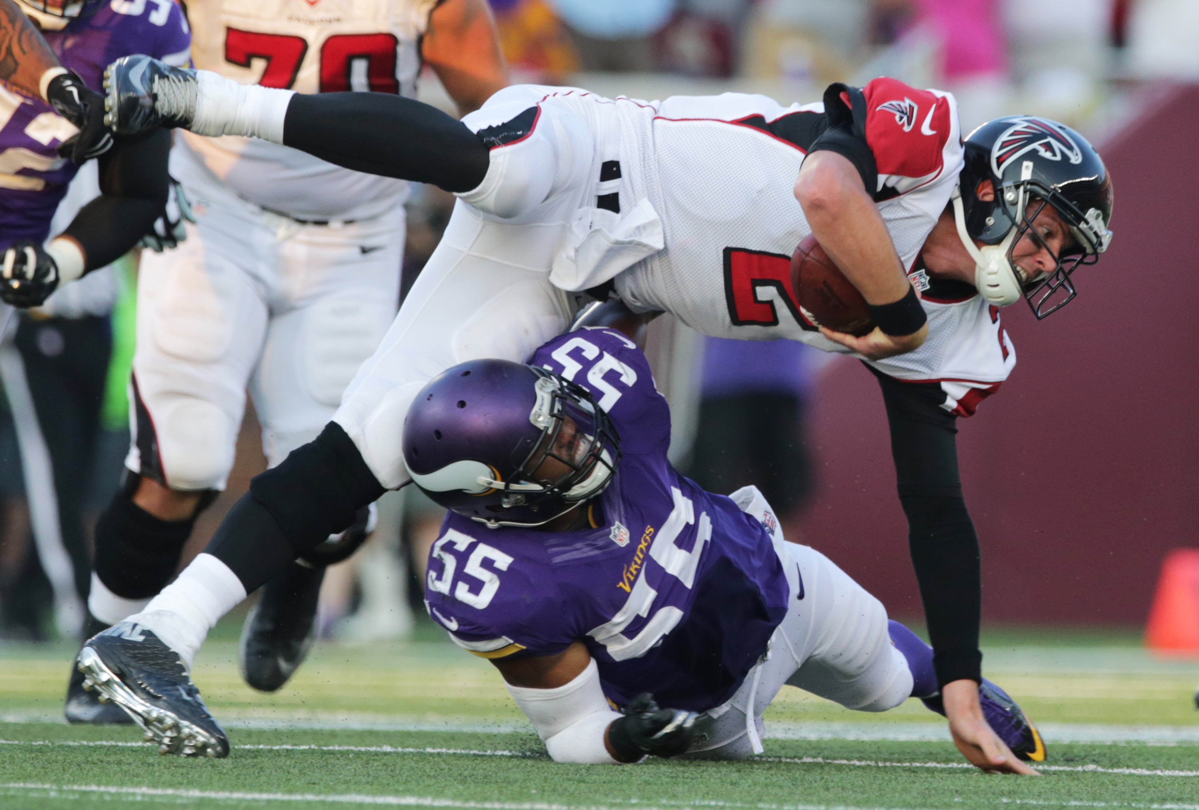 Minnesota Vikings outside linebacker Anthony Barr (55) tackles Atlanta Falcons quarterback Matt Ryan during the second half of an NFL football game, Sunday, Sept. 28, 2014, in Minneapolis. (AP Photo/Jim Mone)