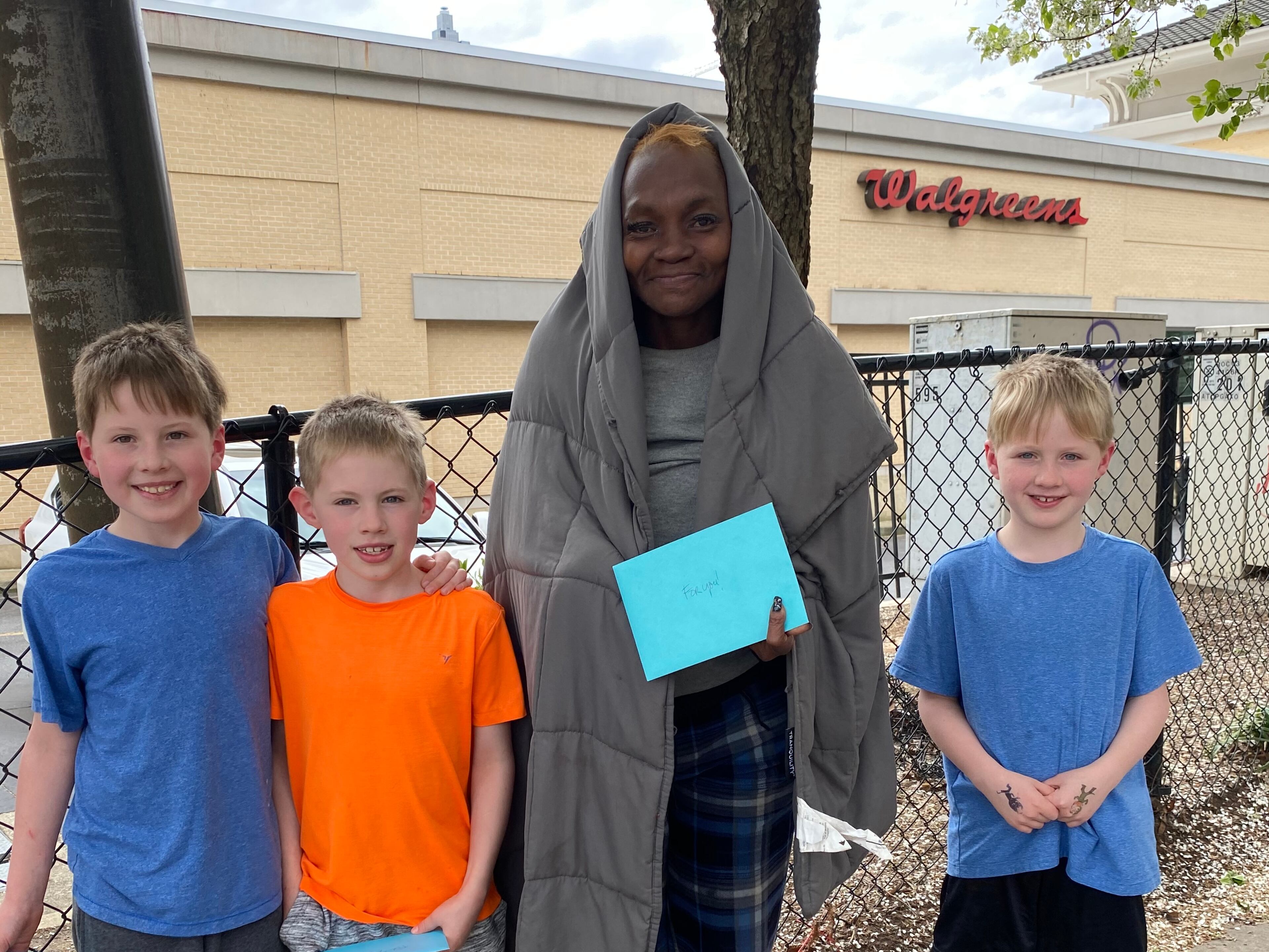 Three of Nancy McGuirk's grandsons -- James, Foster and Micah -- helped her deliver Easter messages of love and hope during the pandemic. (Courtesy of Nancy McGuirk)