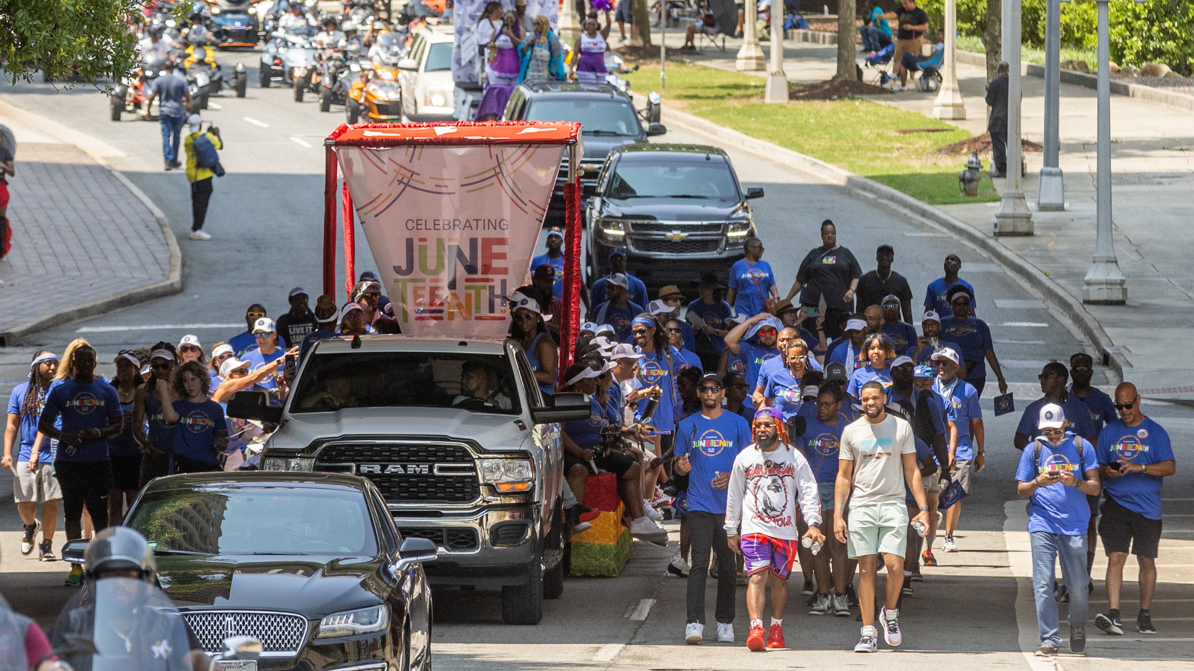 Parade participants head down Capitol Ave. on their way to Centennial Park during the Juneteenth Atlanta Parade and Music Festival Saturday, June 17, 2023. (Steve Schaefer/AJC)