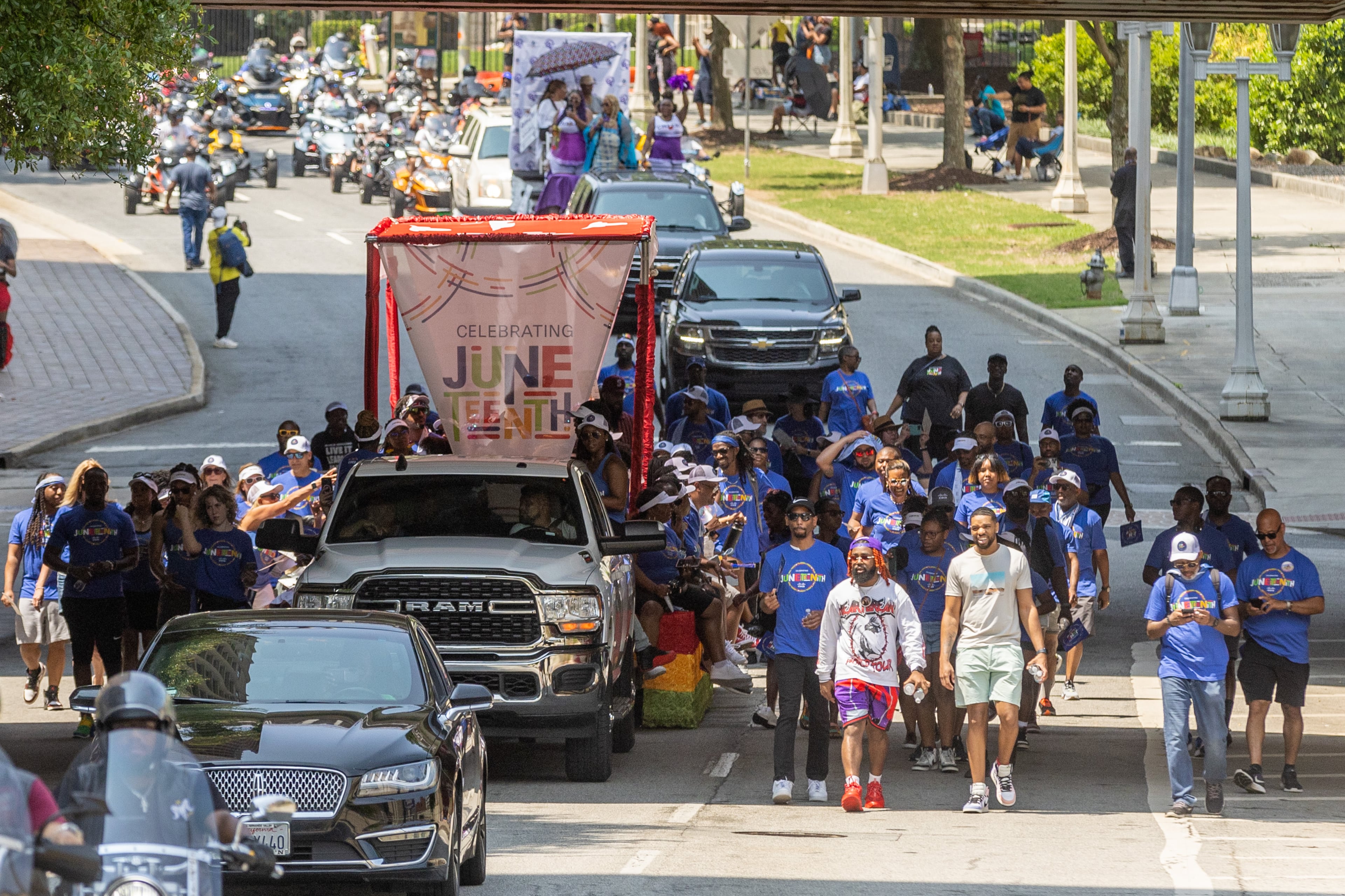 Parade participants head down Capitol Ave. on their way to Centennial Park during the Juneteenth Atlanta Parade and Music Festival Saturday, June 17, 2023. (Steve Schaefer/AJC)