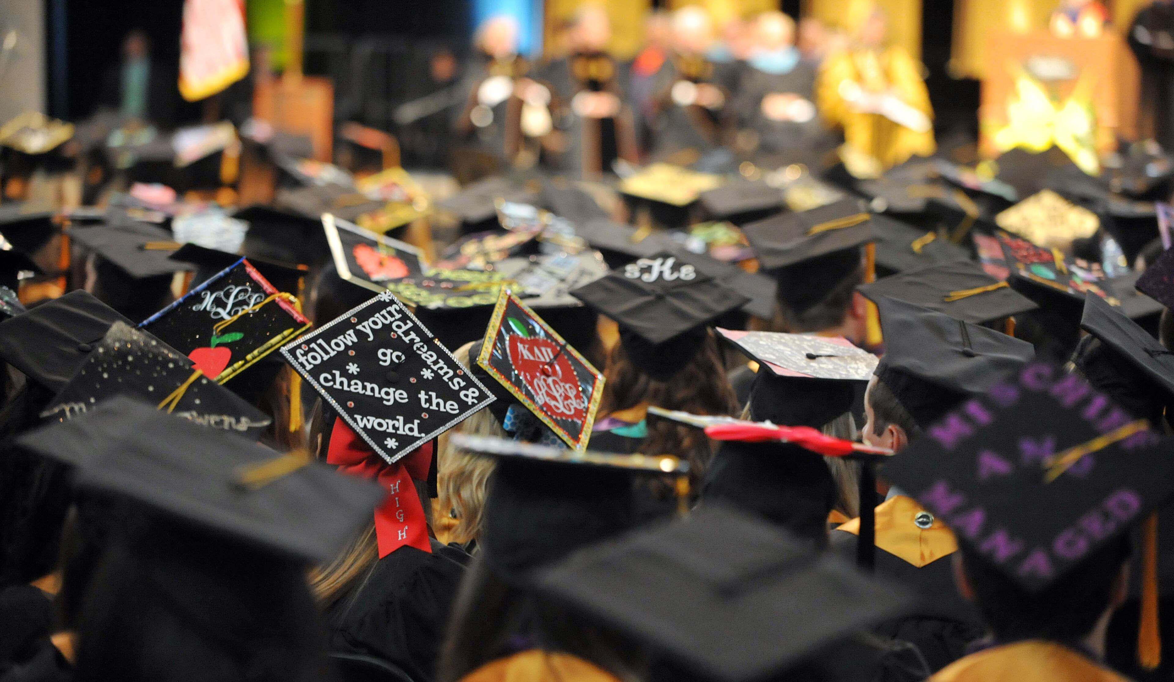 Graduates in the Bagwell College of Education, display their decorated mortar boards. Kennesaw State University's spring commencement was held in the Convocation Center, Wednesday, May 14, 2014. Students in the university's Bagwell College of Education, College of the Arts, WellStar College of Health and Human Services, and the University College heard the keynote address from Georgia first lady Sandra Deal. KENT D. JOHNSON/KDJOHNSON@AJC.COM