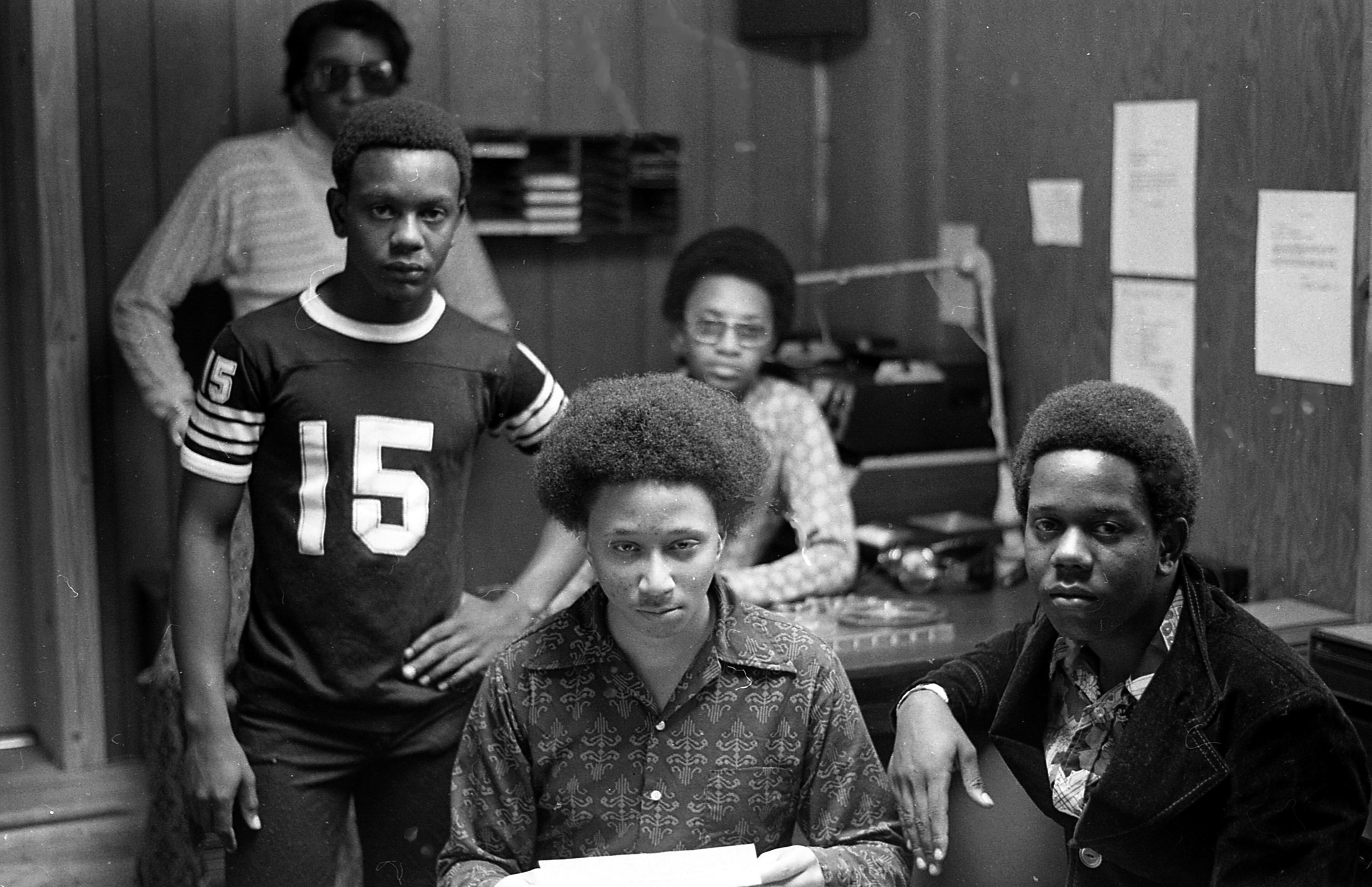 An aspiring sixteen-year old disc jockey named Wayne Williams poses with acquaintances in the basement of his father’s house in Dixie Hills in 1971. Williams’ father, Homer, persuaded Lewis to write a story for the Atlanta Voice about his son, who hoped to become a force in the music business. Eight years later, a series of unsolved murders involving 28 African American children, teenagers, and adults began. These lasted through 1981 after Williams was detained by police suspicious of his activity. Shortly thereafter, Williams was arrested, tried, and convicted for the murder of two victims, although evidence was uncovered linking him to others. Williams is serving a life sentence.