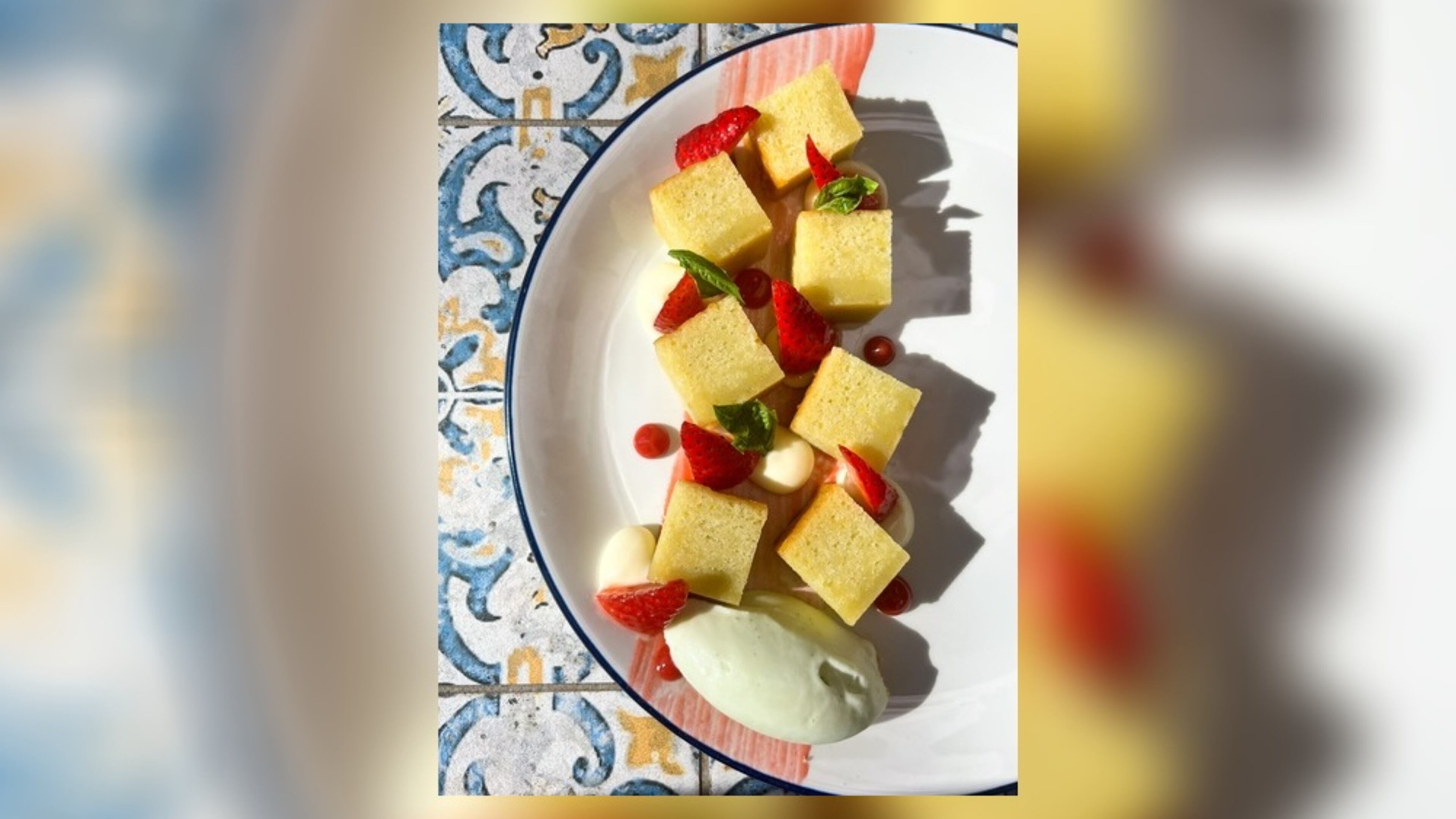 The White Bull’s olive oil cake, shown here with strawberry gel, macerated strawberries, lemon crema and basil gelato, changes seasonally. (Rachel Petro/Courtesy of the White Bull)