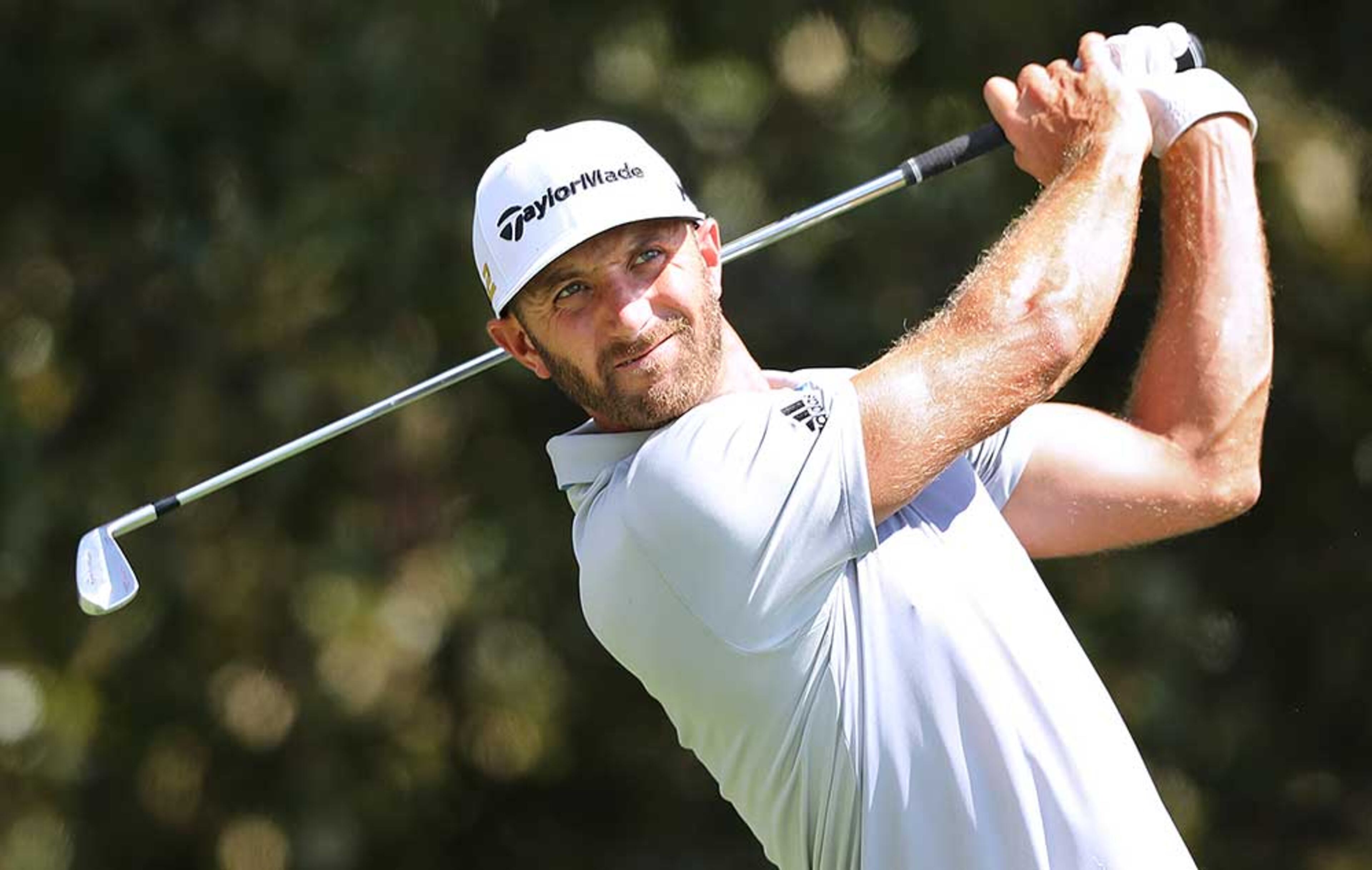 Dustin Johnson tees off on the third hole during the first round of the Tour Championship at East Lake Golf Club on Thursday.
