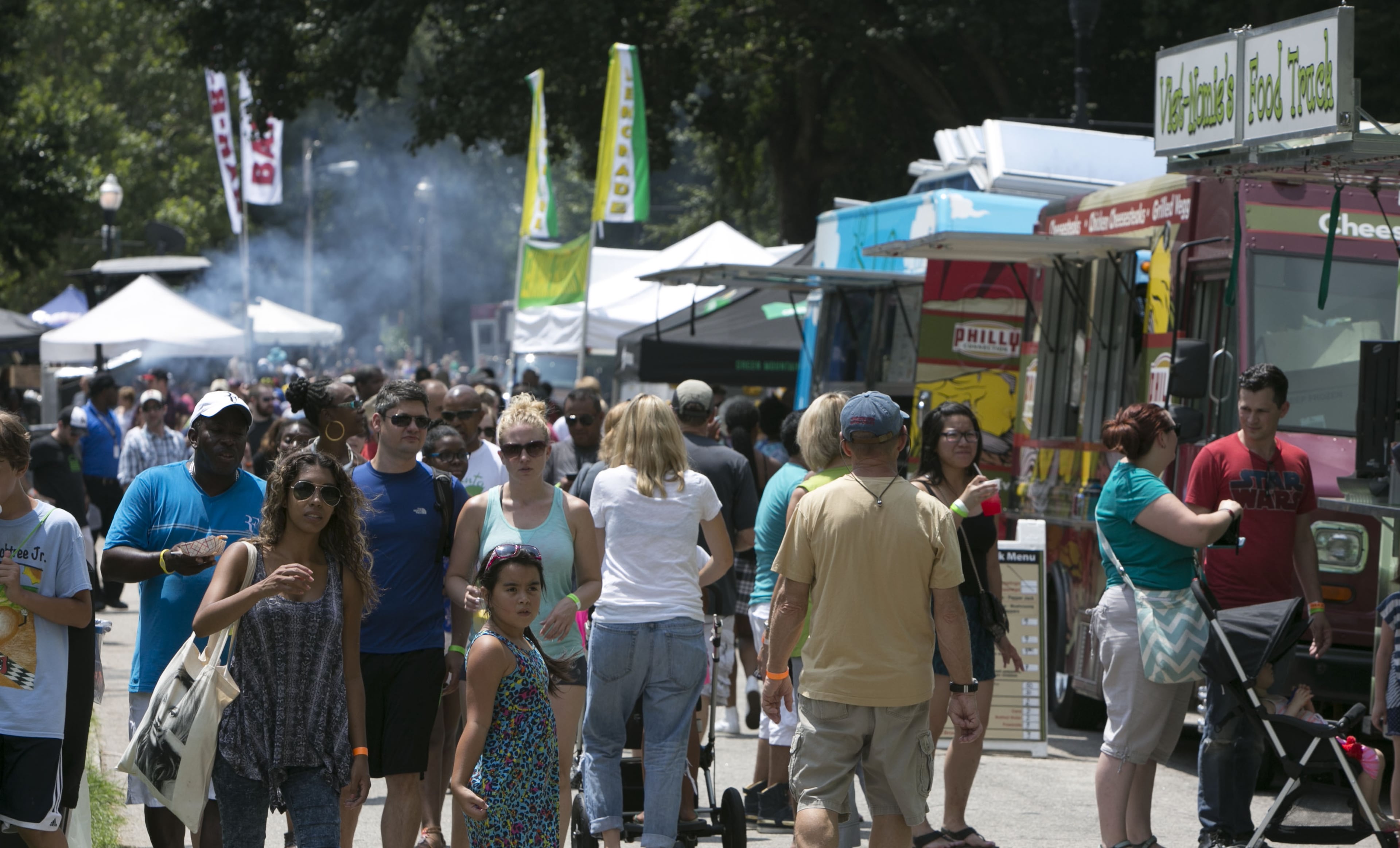 Hundreds attended Atlanta Street Food Festival.Presented by MARTA, the event proceeds will support the Giving kitchen, which provides crisis grants to members of Atlanta's restaurant community facing unanticipated hardship. More than 40 food trucks lined the park's walkway to offer a wide variety of cuisine. (Photo by Phil Skinner)