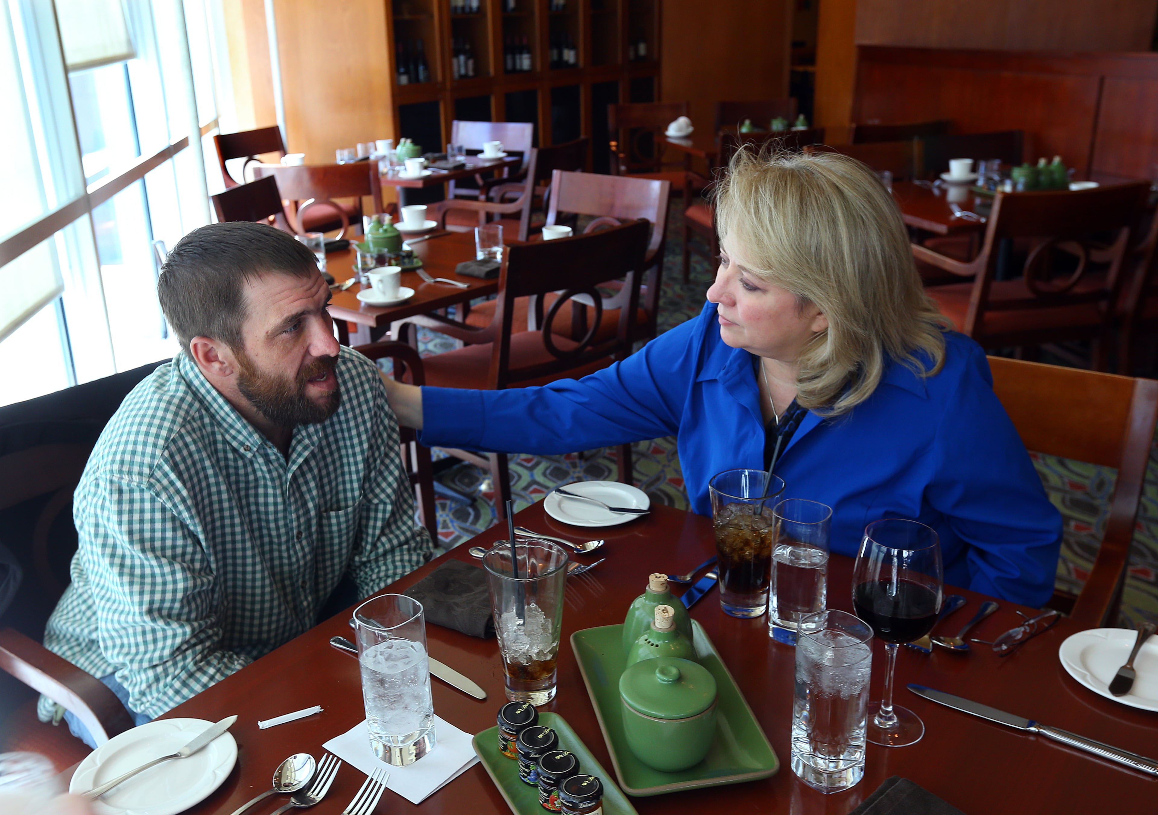 Joel Hartman, the homeless man who returned a woman's wallet he found digging through trash hoping to find someone's leftover meal, was reunited with his stepmother Deanna Rodecki during a Thanksgiving Day meal at the Omni Hotel at CNN Center on Thursday, Nov. 28, 2013, in Atlanta. His stepmother has been searching for Hartman for more than a decade.