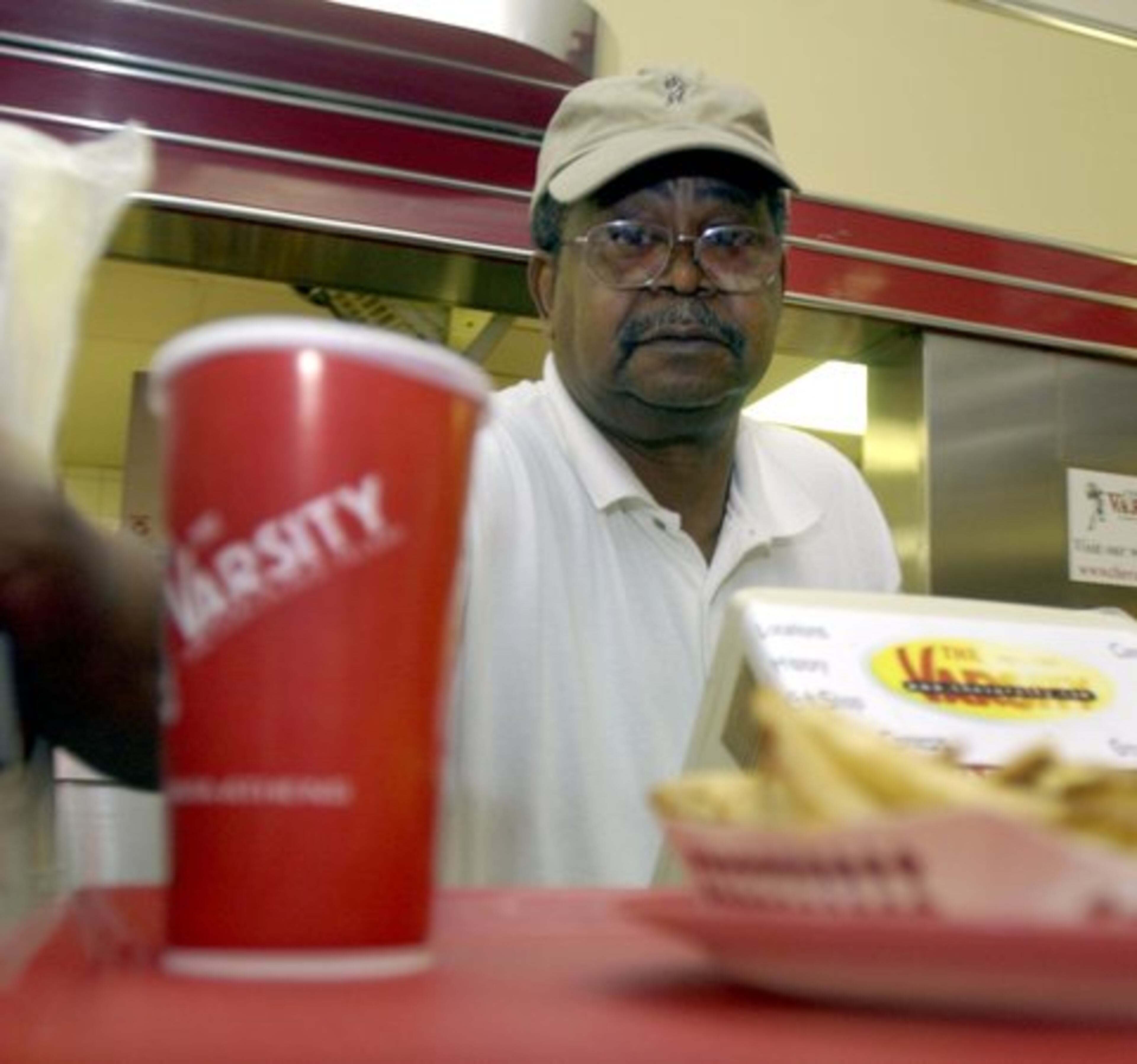 On Georgia Tech football Saturdays, Walker served perhaps as many as 5,000 customers, his supervisor said in 2003. 'I hate to go, ' Walker, 66, said as retirement neared. "But I know I need to go. Because I ain't getting no younger."
