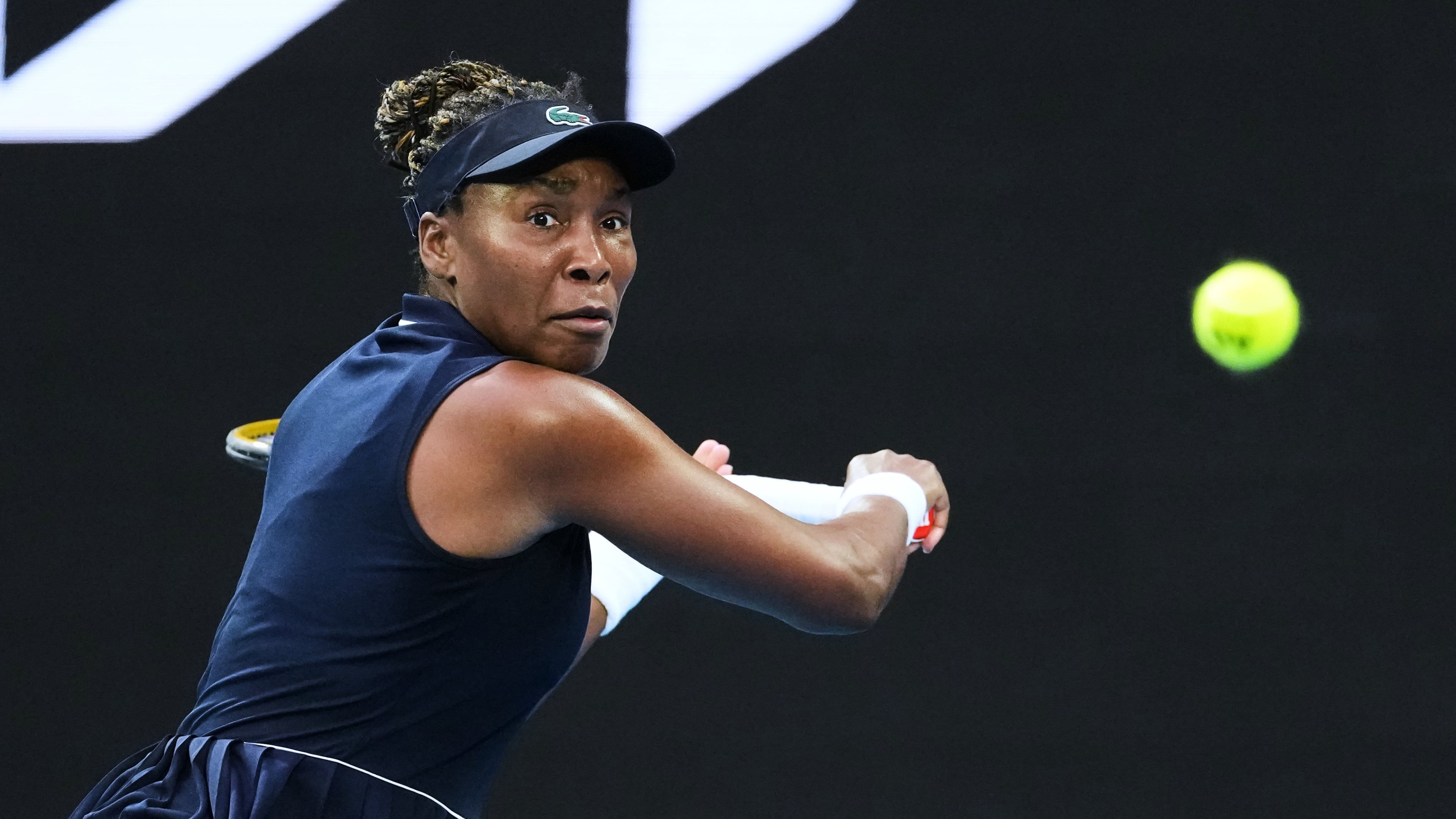 FILE - Venus Williams, of the United States, plays a backhand return to Olga Danilovic, of Serbia, during their first round match at the Australian Open tennis championship in Melbourne, Australia, Jan. 18, 2026. (AP Photo/Aaron Favila, File)