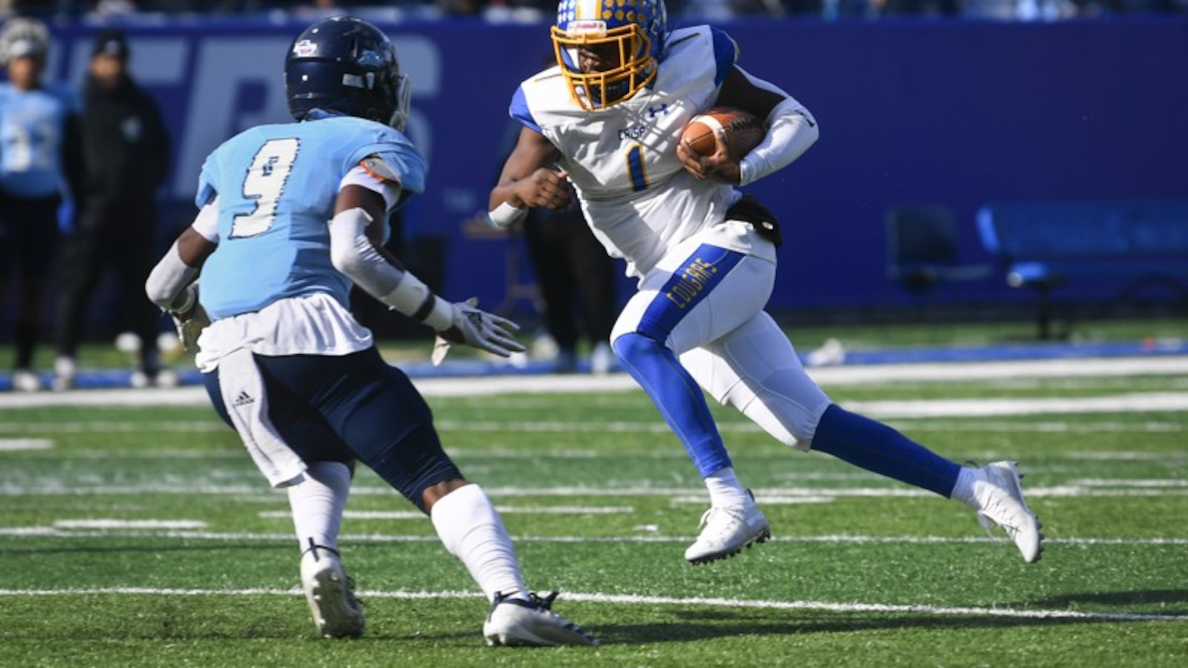 Crisp County QB AJ Lofton runs as Cedar Grove Safety Jordan Greer (9) defends during the AAA state title football game on Saturday Dec.14, 2019. John Amis / Special