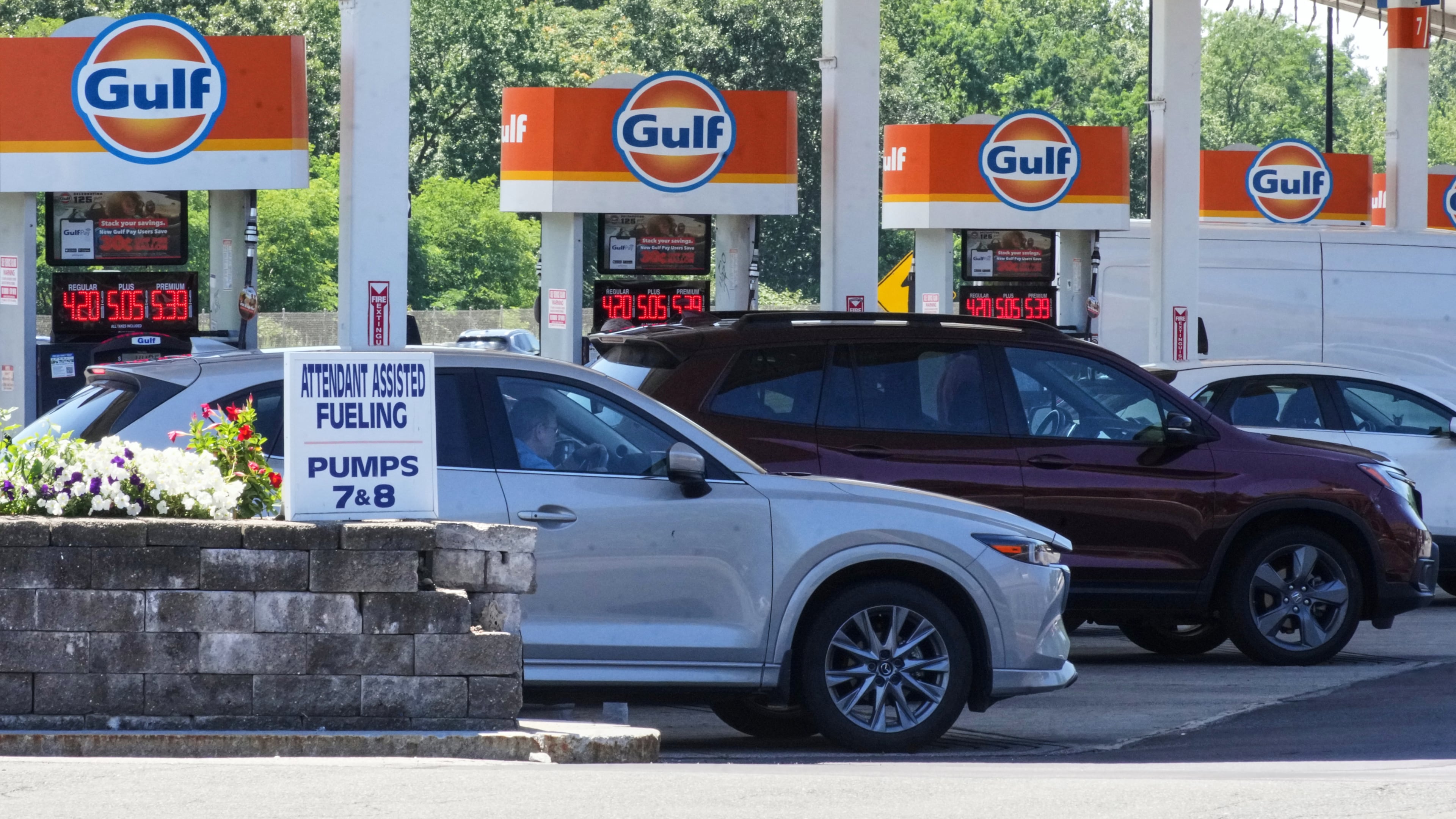 FILE - Cars line up at the pumps of a Gulf Oil station on the Massachusetts Turnpike near Boston, Sunday, July 19, 2026. (AP Photo/Gene J. Puskar, File)