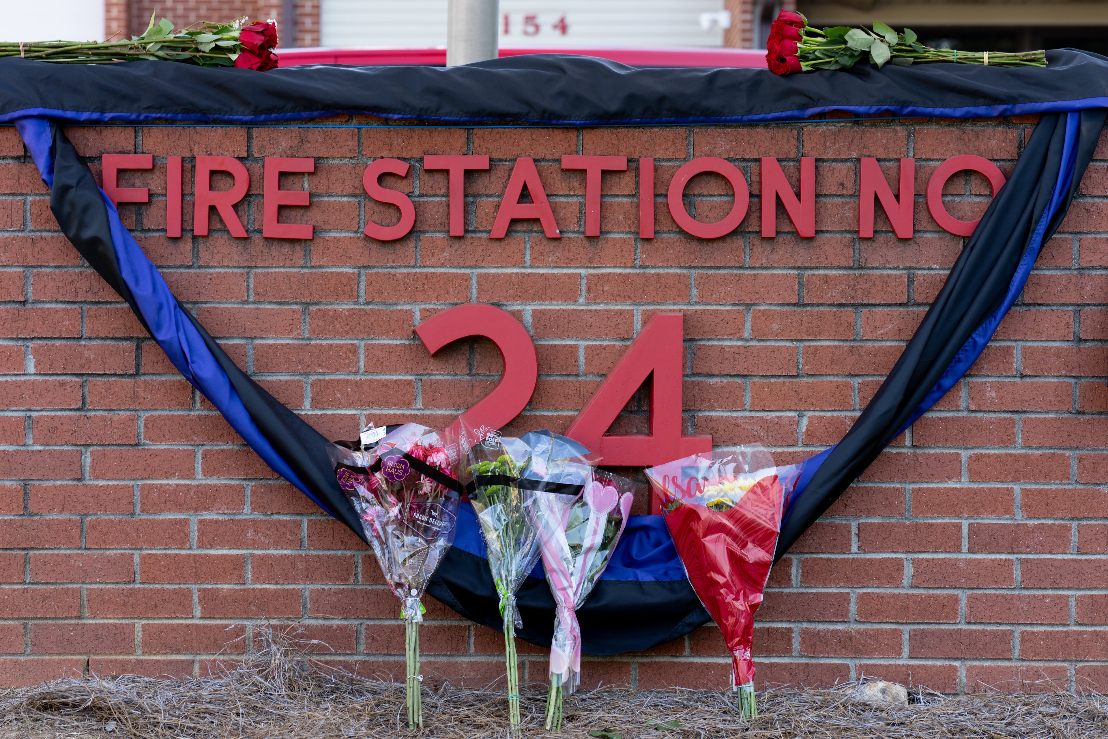 A small memorial outside of Dekalb County Fire Station No. 24 honors firefighter Preston Fant on Wednesday, Sept. 10, 2025. (Ben Hendren for the AJC)