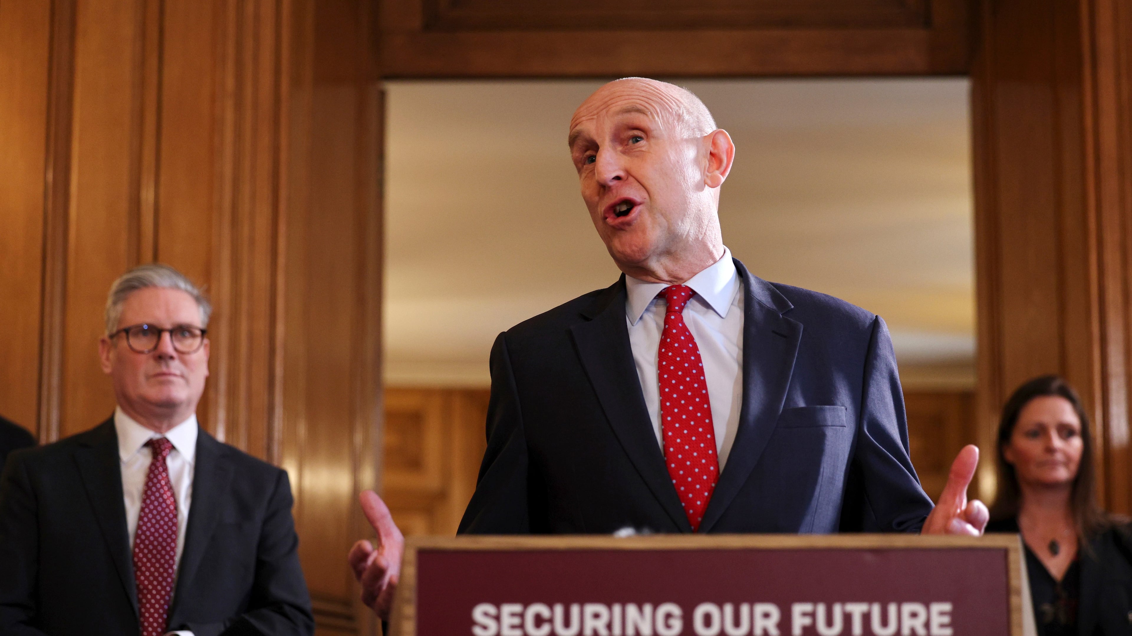 FILE - Britain's Prime Minister Keir Starmer, left, looks on as Defence Secretary John Healey speaks to apprentices and representatives in the defence industry, during a careers fair inside 10 Downing Street in central London, Monday March 3, 2025. (Adrian Dennis/Pool via AP, File)
