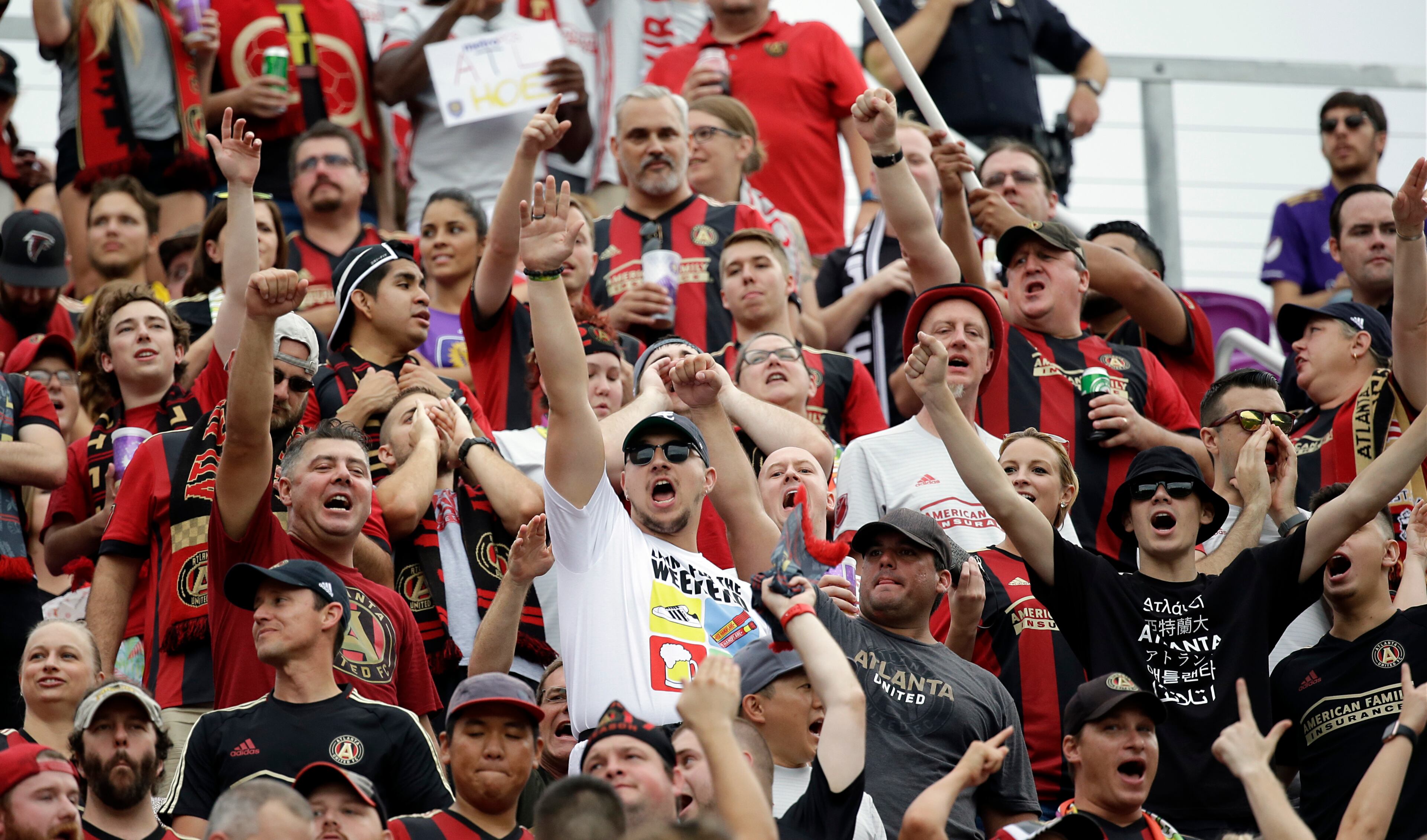 Atlanta United fans cheer during the first half of an MLS soccer match between Orlando City and Atlanta United, Friday, July 21, 2017, in Orlando, Fla. (AP Photo/John Raoux)