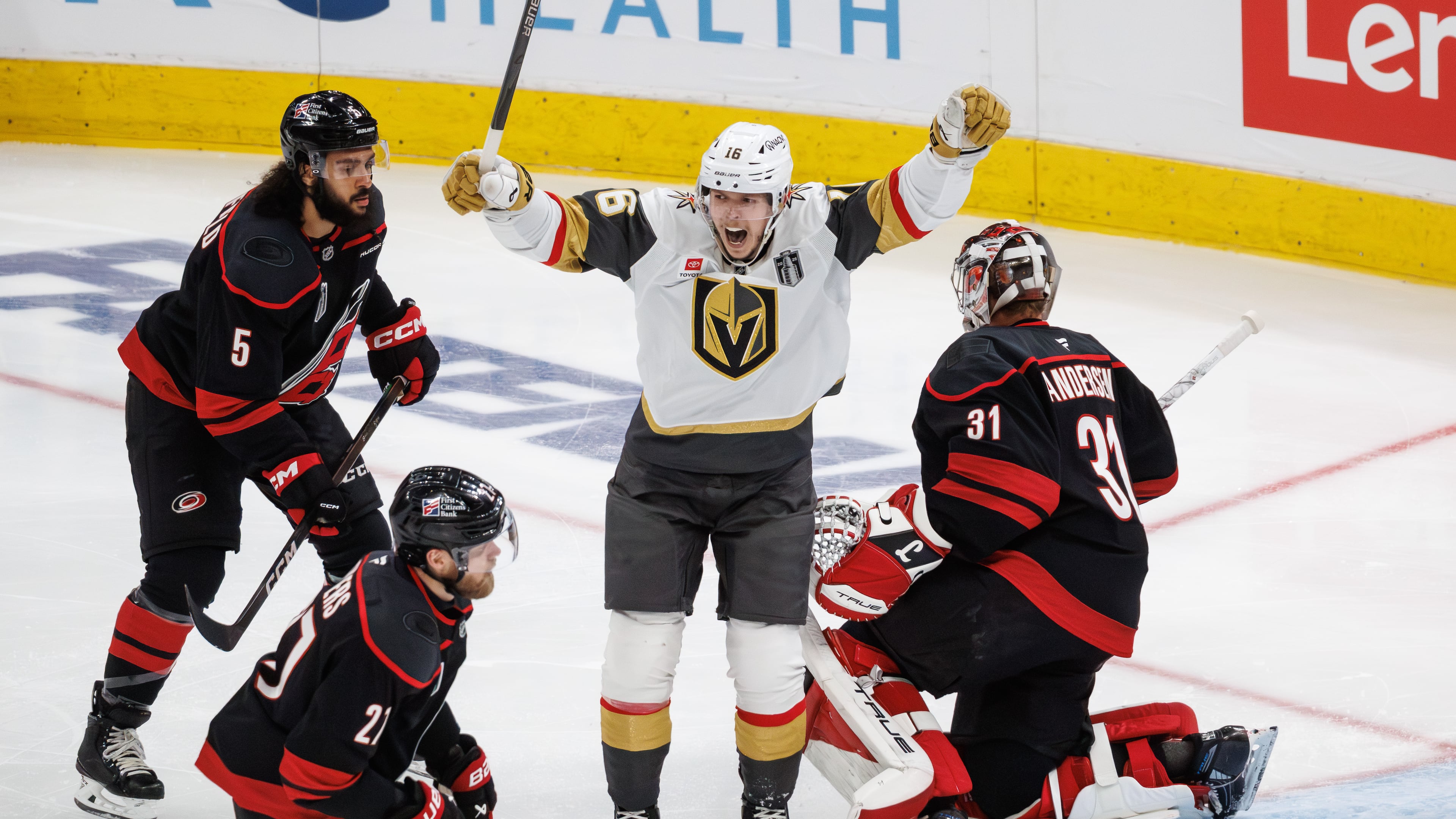 Vegas Golden Knights' Pavel Dorofeyev (16) celebrates between Carolina Hurricanes' Jalen Chatfield (5), Alexander Nikishin (21), and goaltender Frederik Andersen (31) after a goal in the second period of Game 1 of the NHL hockey Stanley Cup Final series in Raleigh, N.C., Tuesday, June 2, 2026. (AP Photo/Ben McKeown)